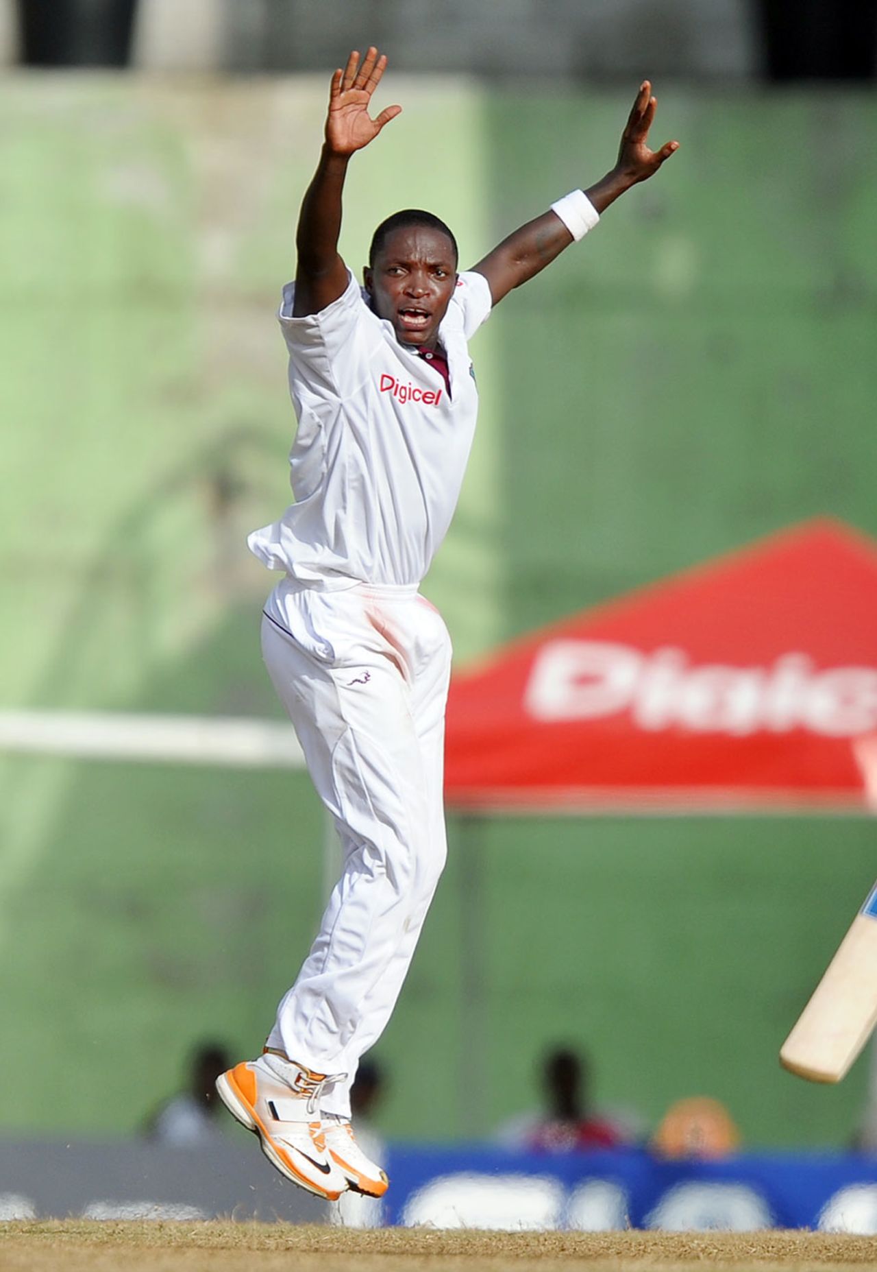 Fidel Edwards celebrates trapping Suresh Raina lbw, West Indies v India, 3rd Test, Dominica, 3rd day, July 8, 2011