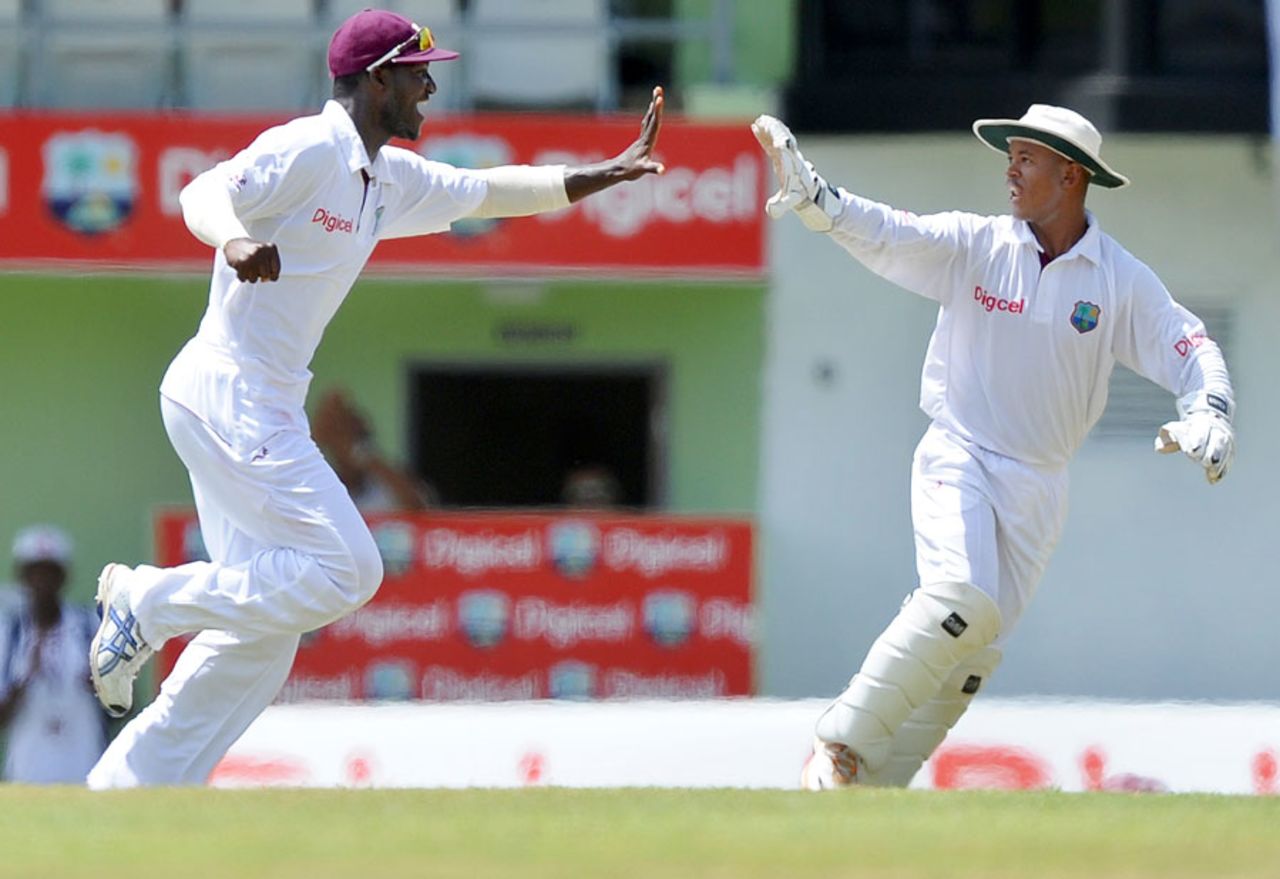 Darren Sammy and Carlton Baugh celebrate MS Dhoni's wicket, West Indies v India, 3rd Test, Dominica, 4th day, July 9, 2011