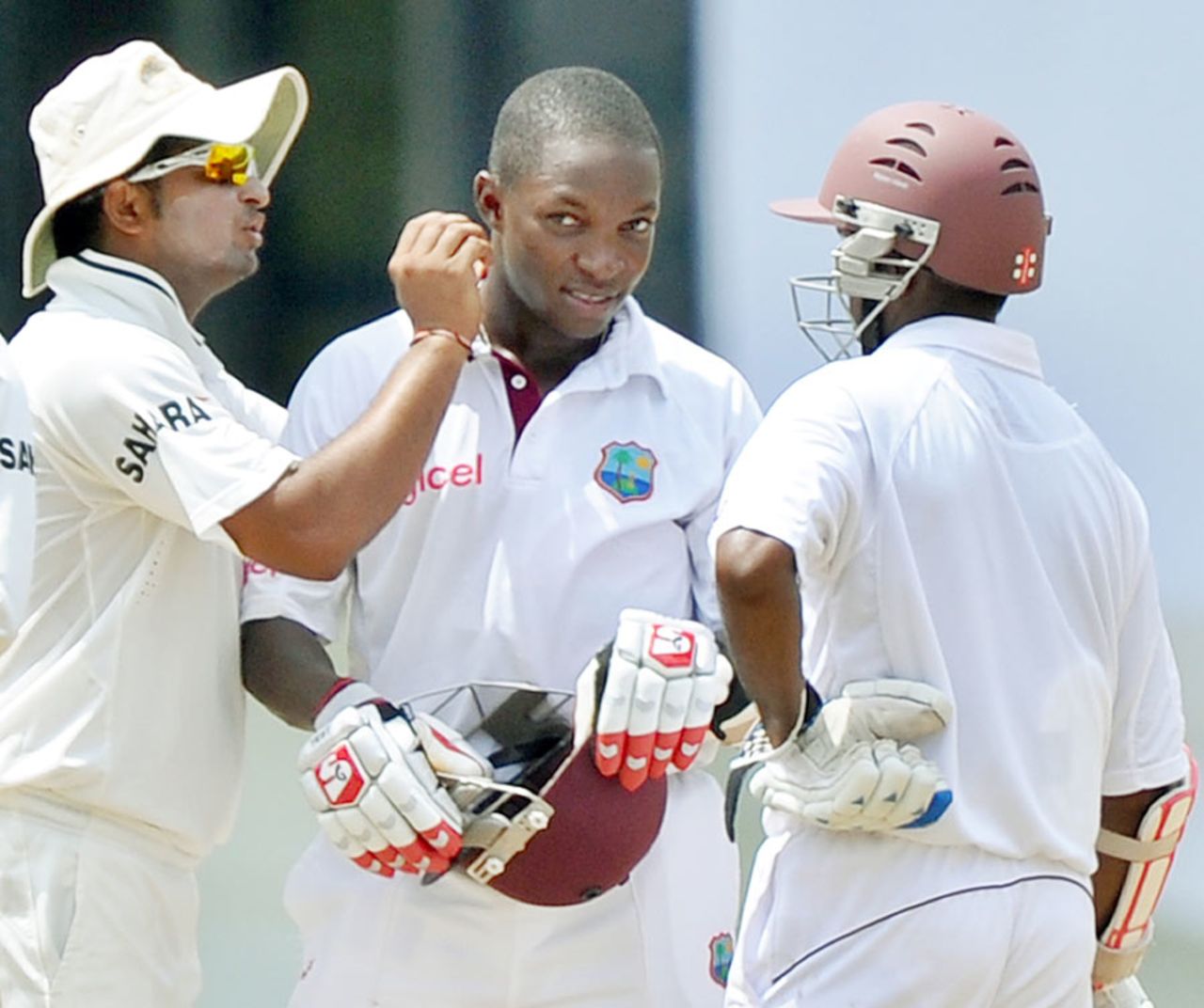 Suresh Raina checks the extent of injury after Fidel Edwards was struck by a bouncer, West Indies v India, 3rd Test, Dominica, 5th day, July 10, 2011