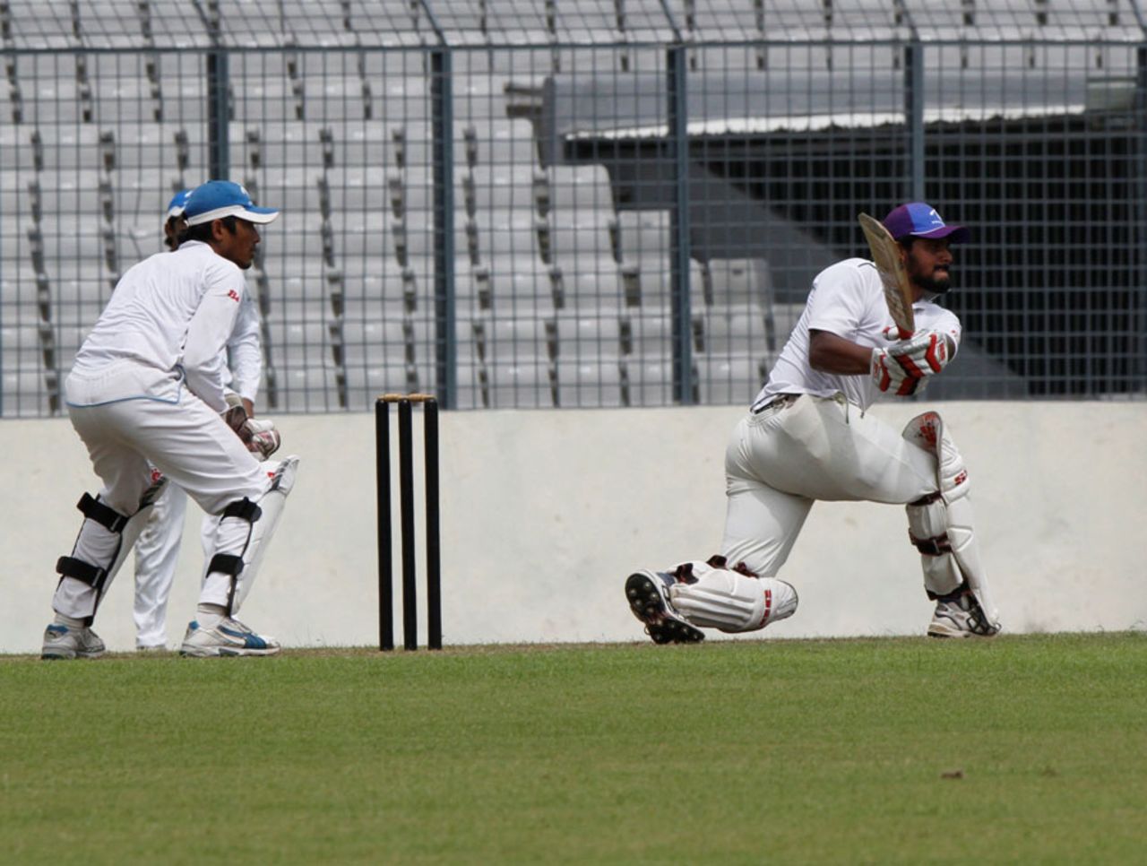 Shahriar Nafees sweeps during a warm-up game, Mirpur, July 17, 2011