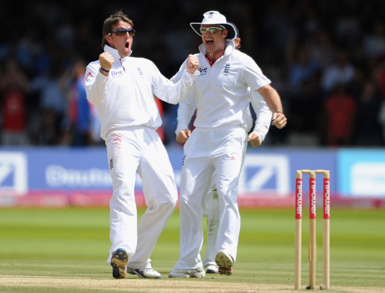 Graeme Swann and Andrew Strauss celebrate Gautam Gambhir's wicket, England v India, 1st Test, Lord's, 5th day, July 25, 2011