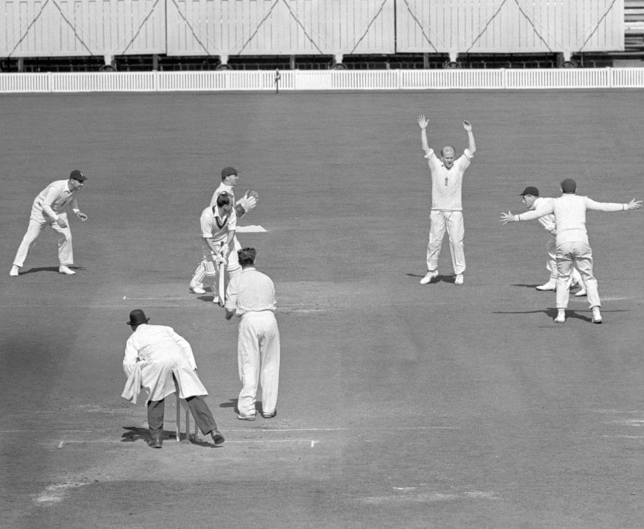 Ray Lindwall is caught by Tony Lock off Jim Laker, England v Australia, 4th Test, Old Trafford, 5th day, July 31, 1956