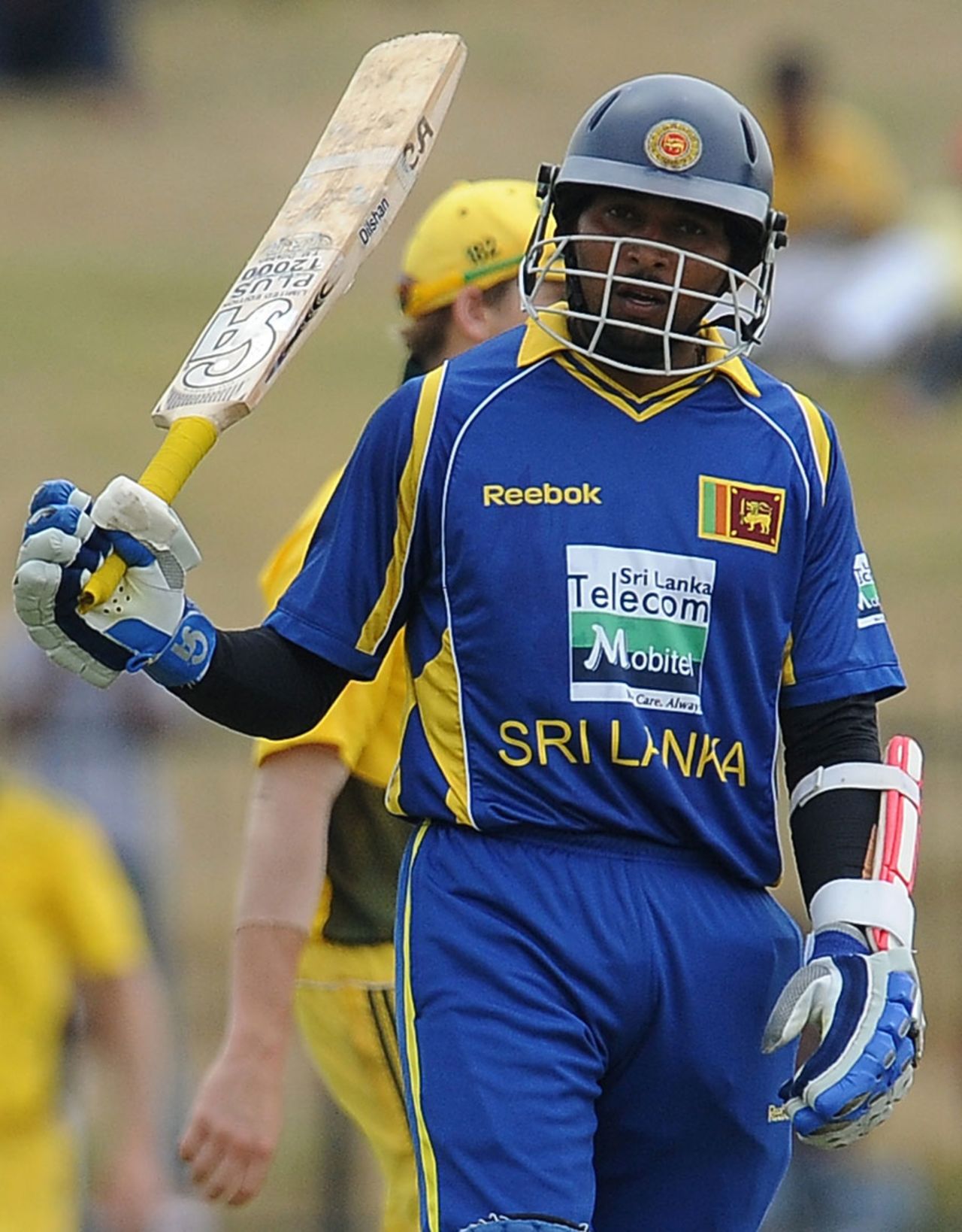 Tillakaratne Dilshan raises his bat after reaching his half-century, Sri Lanka v Australia, 3rd ODI, Hambantota, August 16, 2011