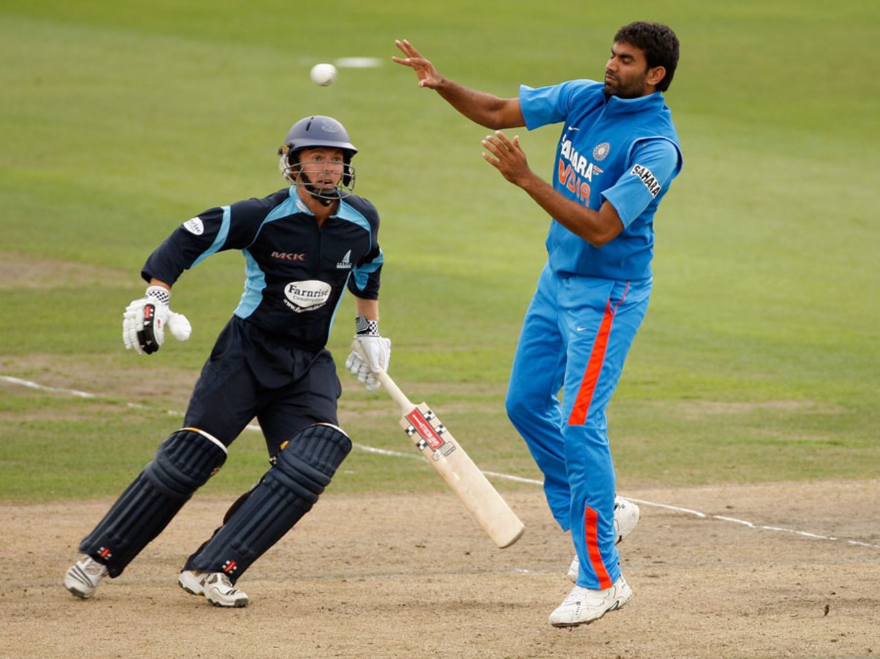 Munaf Patel tries to field off his bowling as Chris Nash looks on, Sussex v Indians, Tour match, Hove, August 25, 2011