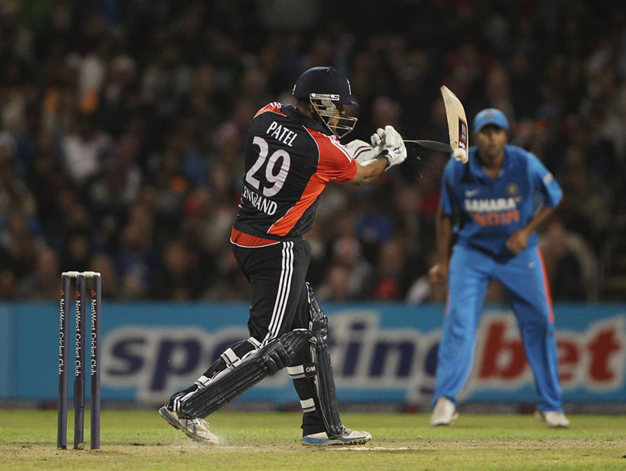Samit Patel's bat splits apart as he throws himself into a drive, England v India, Twenty20, Old Trafford, August 31, 2011