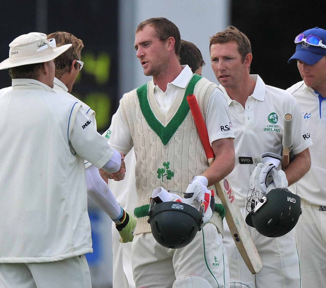John Mooney and Andrew White are congratulated by the Namibia fielders after the match, Ireland v Namibia, Intercontinental Cup, 1st day, Belfast, September 9, 2011
