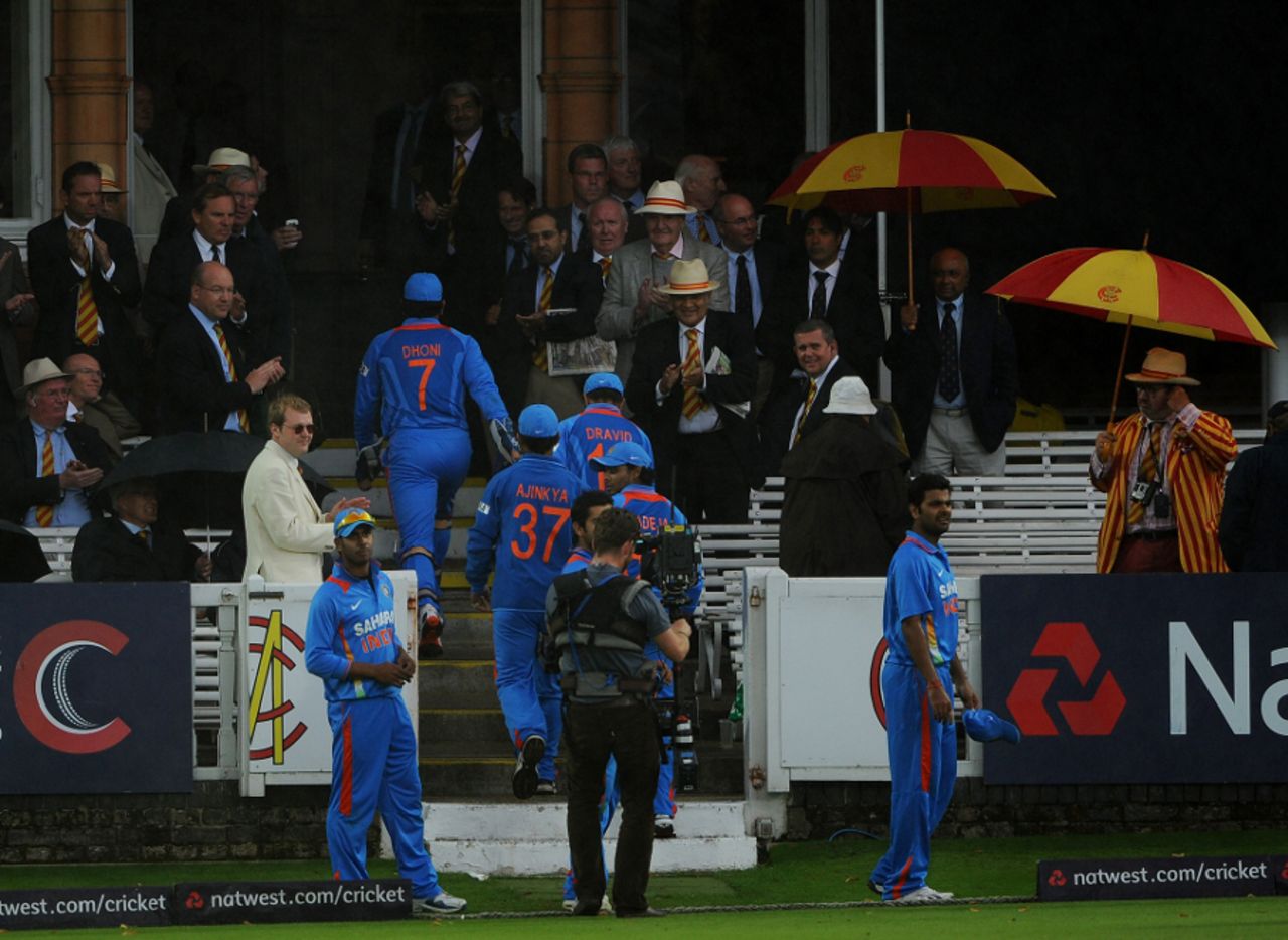 The players leave the field as the rain falls at Lord's, England v India, 4th ODI, Lord's, September 11, 2011