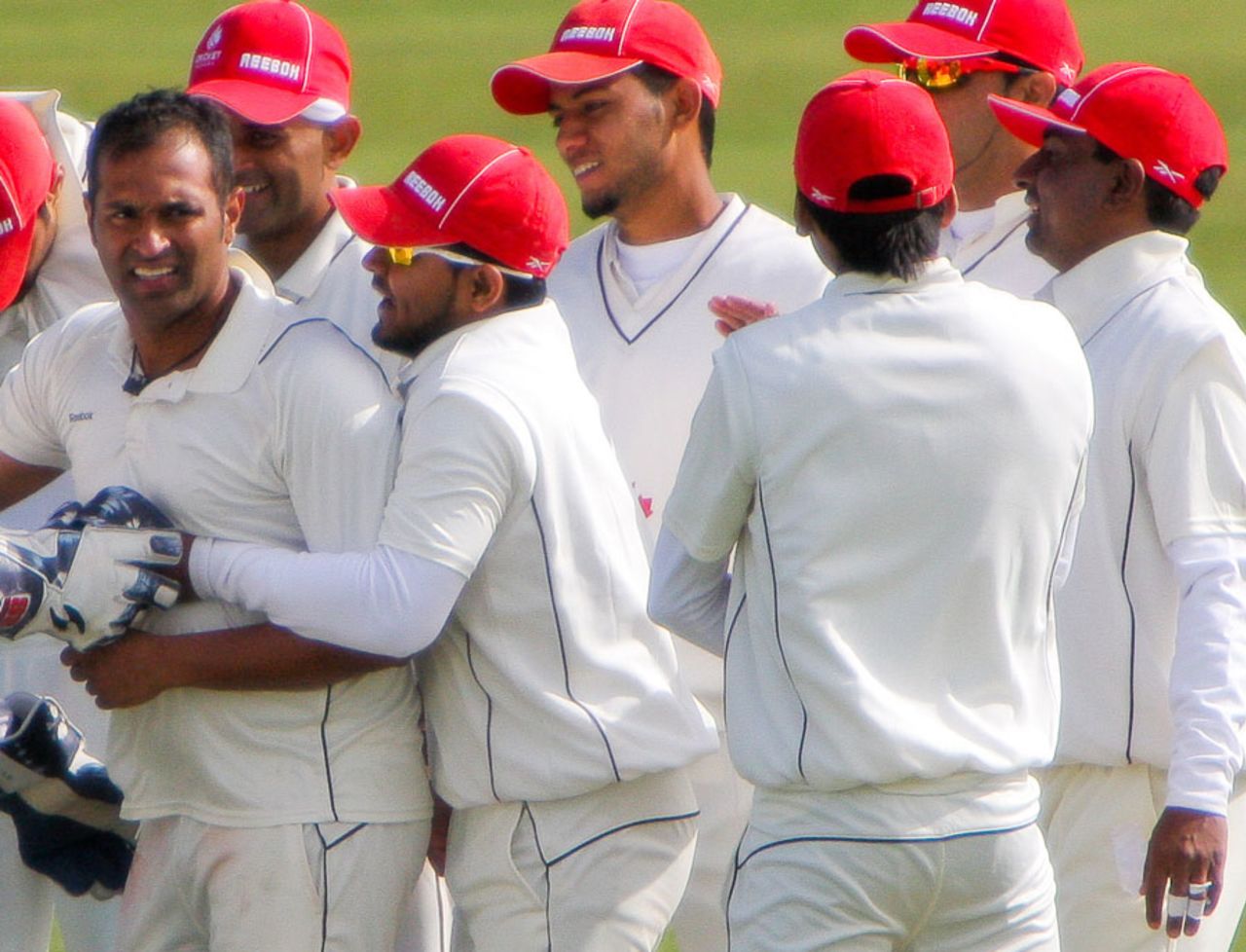 Khurram Chohan is congratulated by his team-mates after dismissing Andrew White, Ireland v Canada, Intercontinental Cup, 1st day, Dublin, September 13, 2011