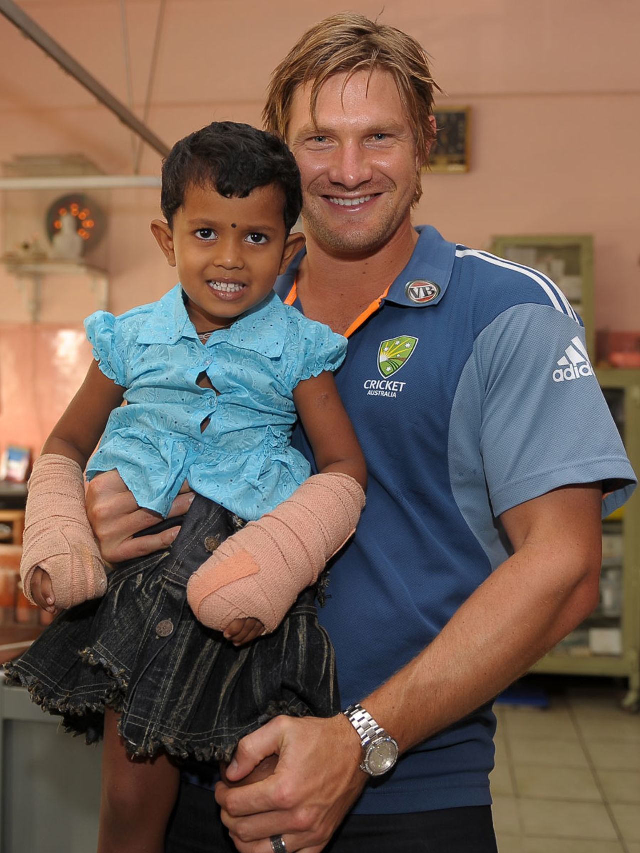 Shane Watson humours a young fan during a visit to the national hospital, Colombo, September 13, 2011