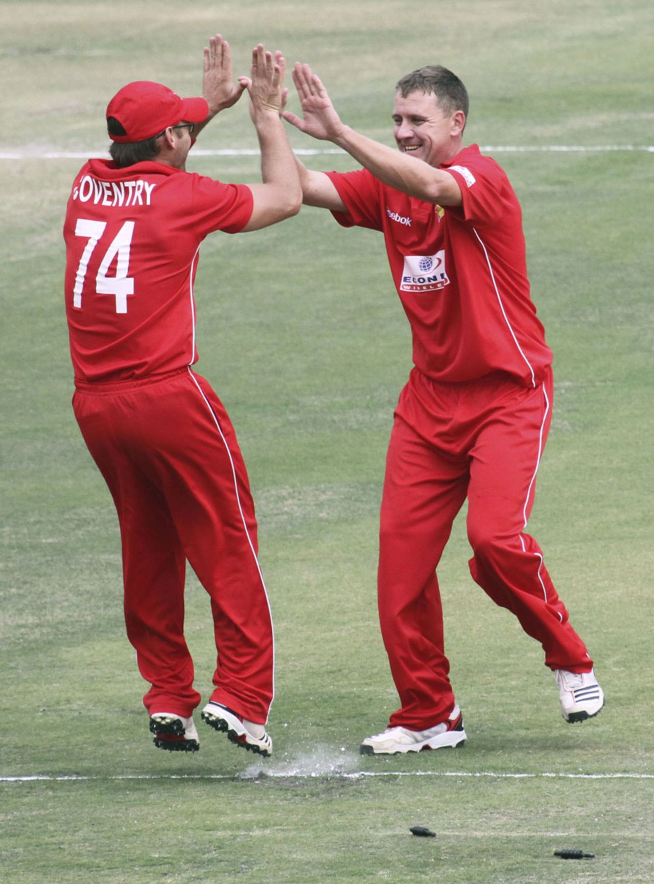 Charles Coventry gets a high five after running out Asad Shafiq, Zimbabwe v Pakistan, 1st Twenty20, Harare, September 16, 2011