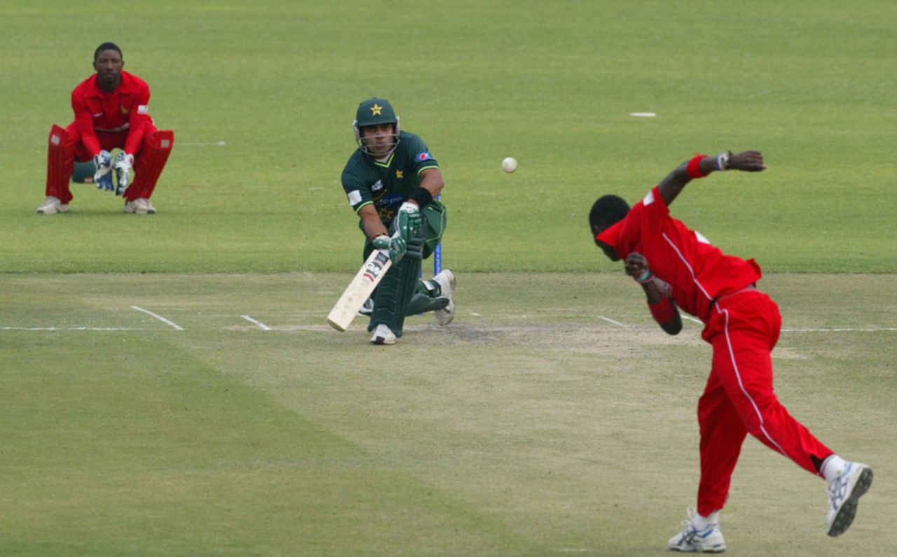 Umar Akmal prepares to lap-sweep Chris Mpofu, Zimbabwe v Pakistan, 1st Twenty20, Harare, September 16, 2011