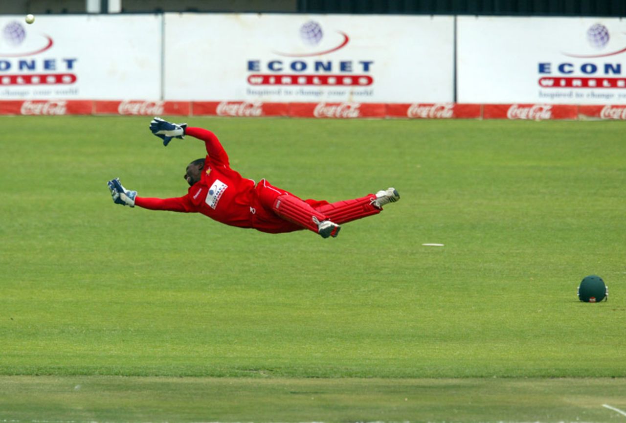 Tatenda Taibu makes an acrobatic dive but cannot stop the ball, Zimbabwe v Pakistan, 1st Twenty20, Harare, September 16, 2011