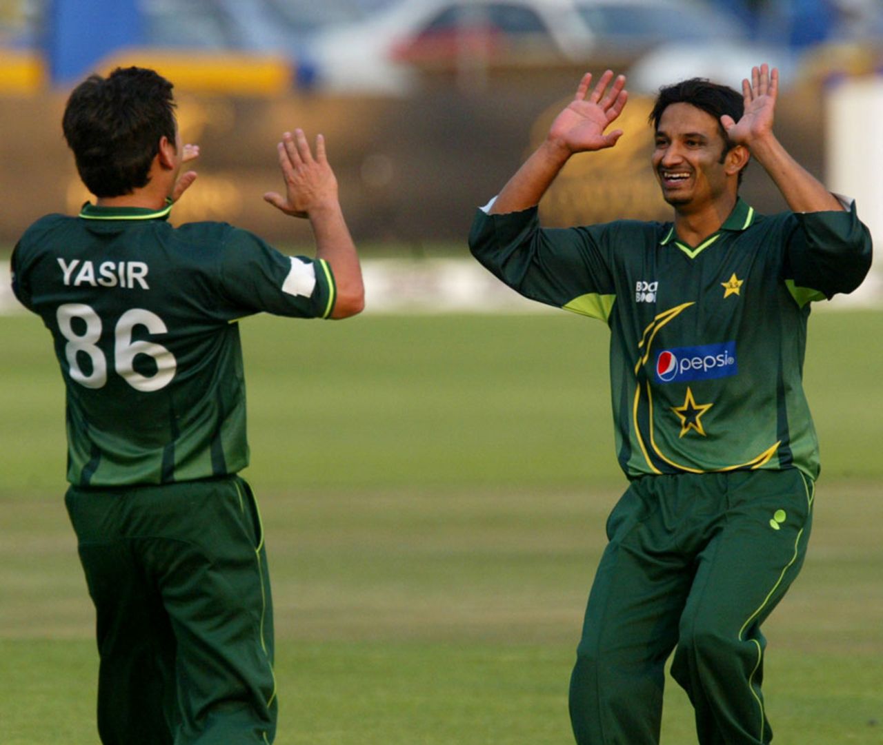 Aizaz Cheema and Yasir Shah celebrate Kyle Jarvis' dismissal, Zimbabwe v Pakistan, 1st Twenty20, Harare, September 16, 2011