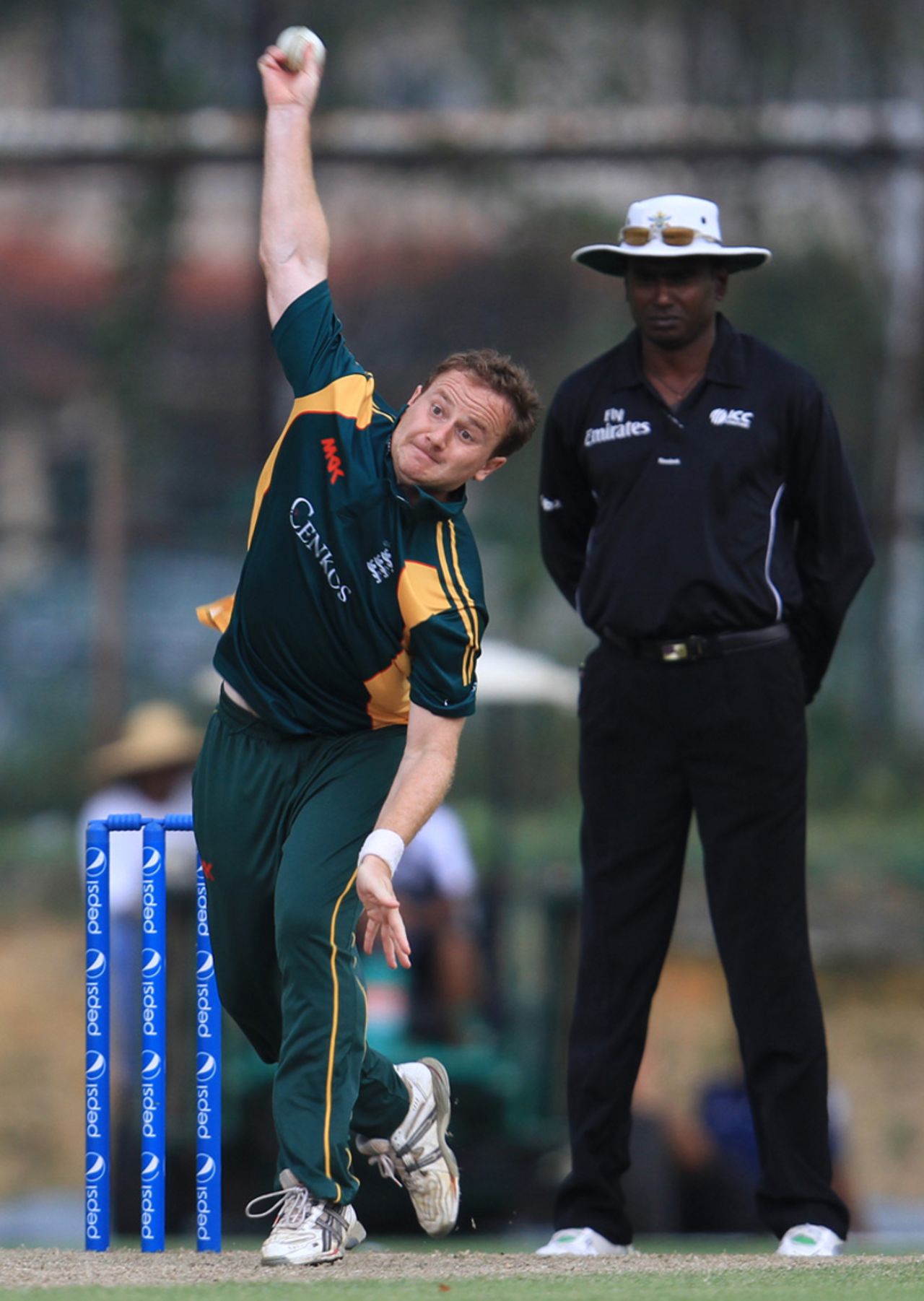 Stuart Bisson bowls for Guernsey, Guernsey v Jersey, World Cricket League Division Six, Kuala Lumpur, September 17 2011