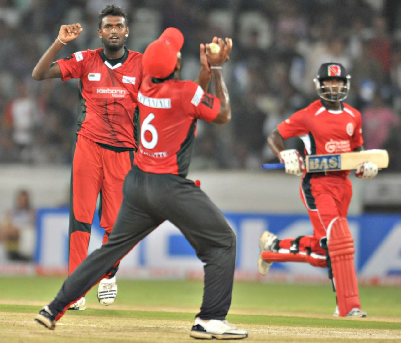 Arosh Janoda looks on as Mahela Udawatte holds a catch, Ruhuna v T&T, CLT20 qualifier, Hyderabad, September 19, 2011