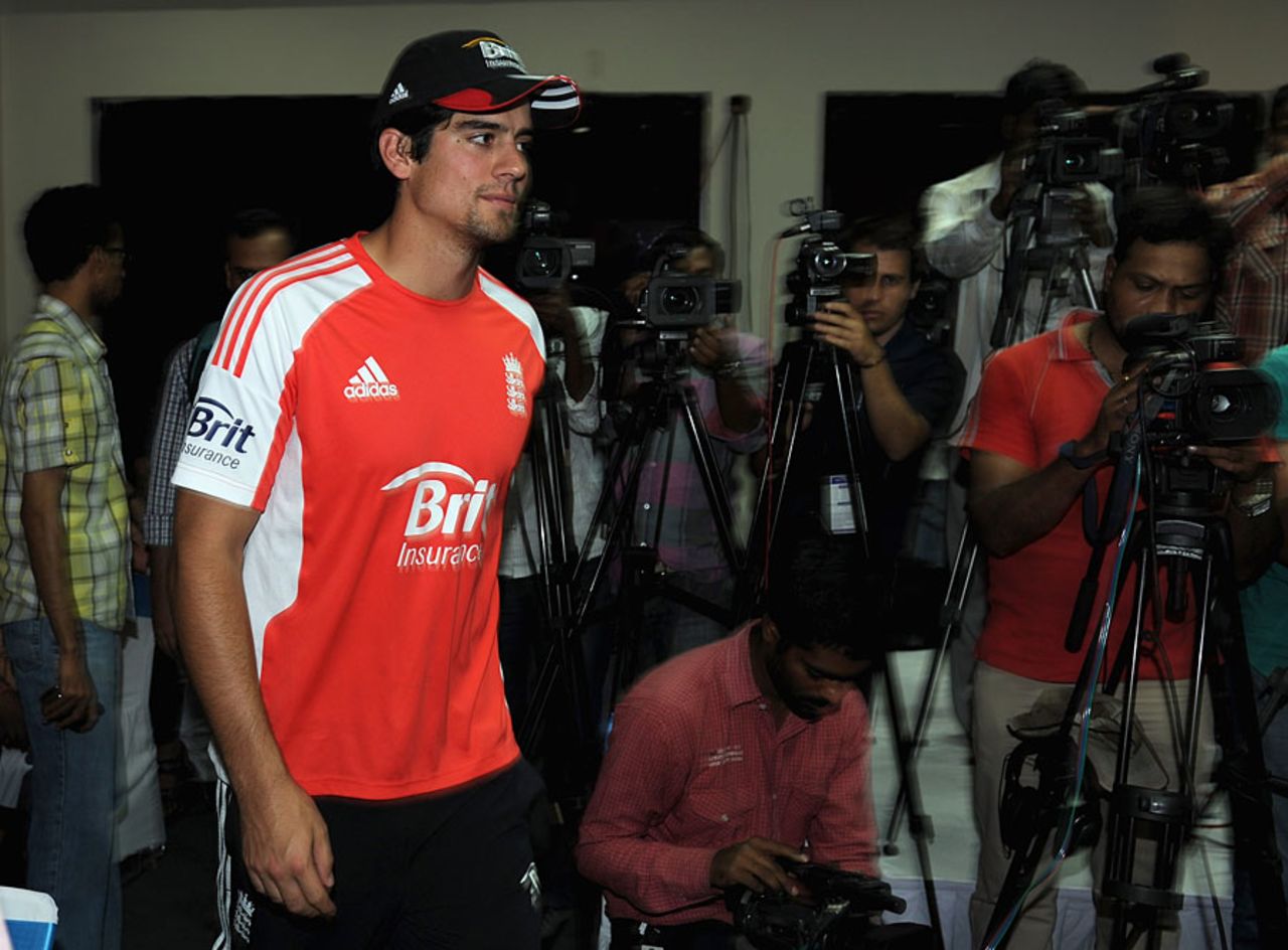 Welcome to India: Alastair Cook arrives at his first press conference of the tour, Hyderabad, October 5, 2011