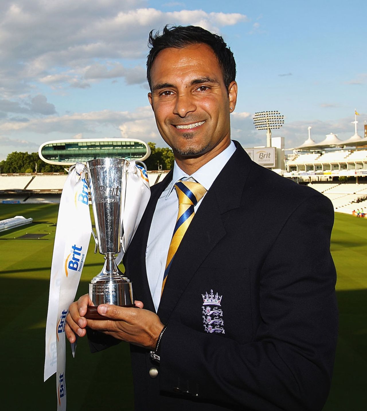 Umesh Valjee, the England Deaf team captain, poses with the Disability Cricketer of the Year Award at the ECB awards, Lord's, May 31, 2011