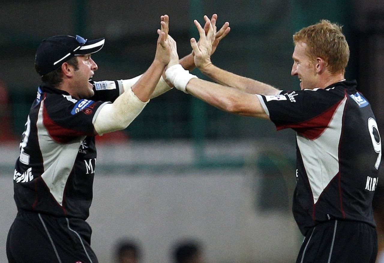 Roelof van der Merwe and Steve Kirby celebrate a wicket, Somerset v Warriors, Champions League T20, Bangalore, October 5, 2011
