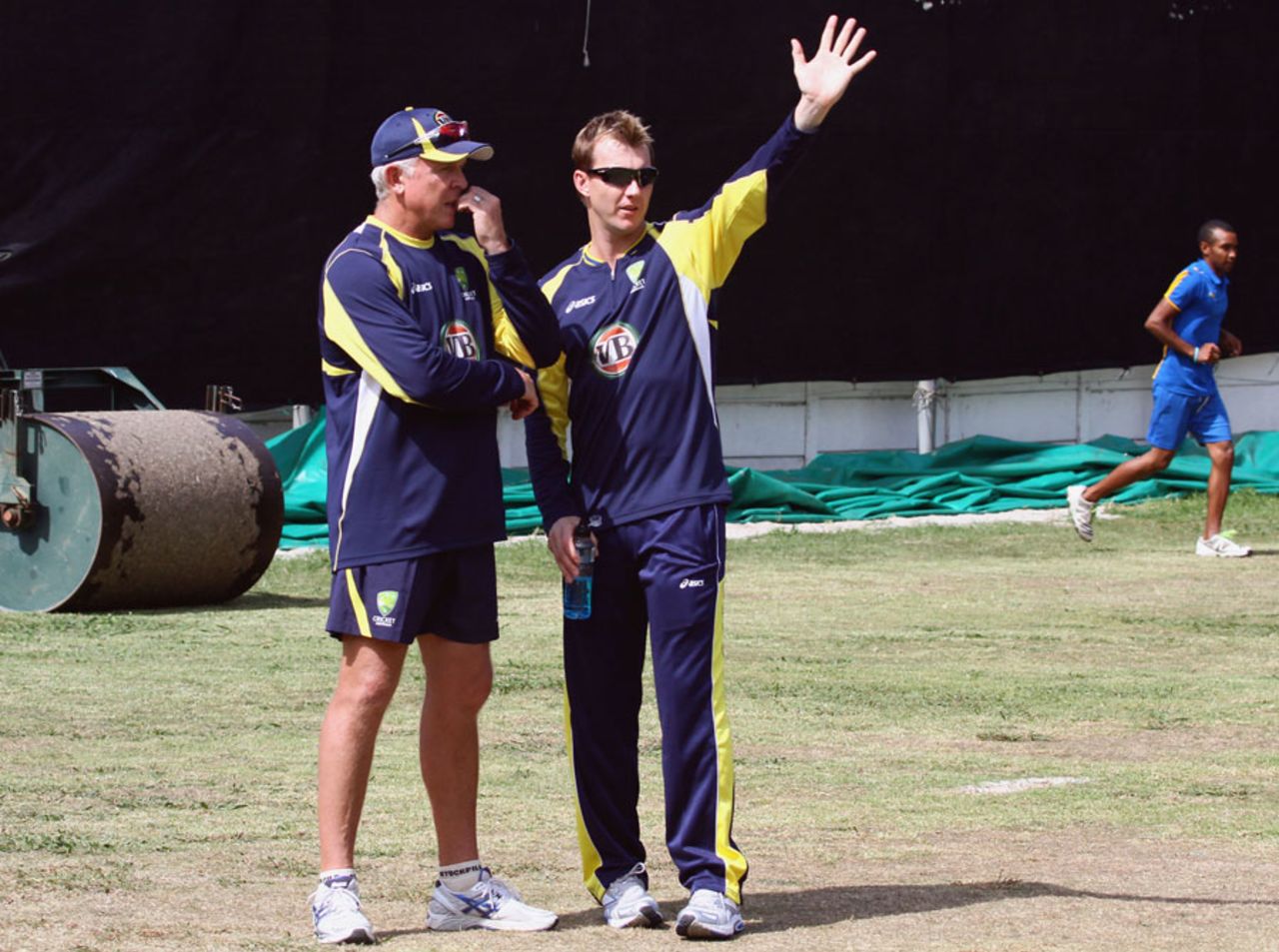 Craig McDermott and Brett Lee chat during a training session, Cape Town, October 12, 2011
