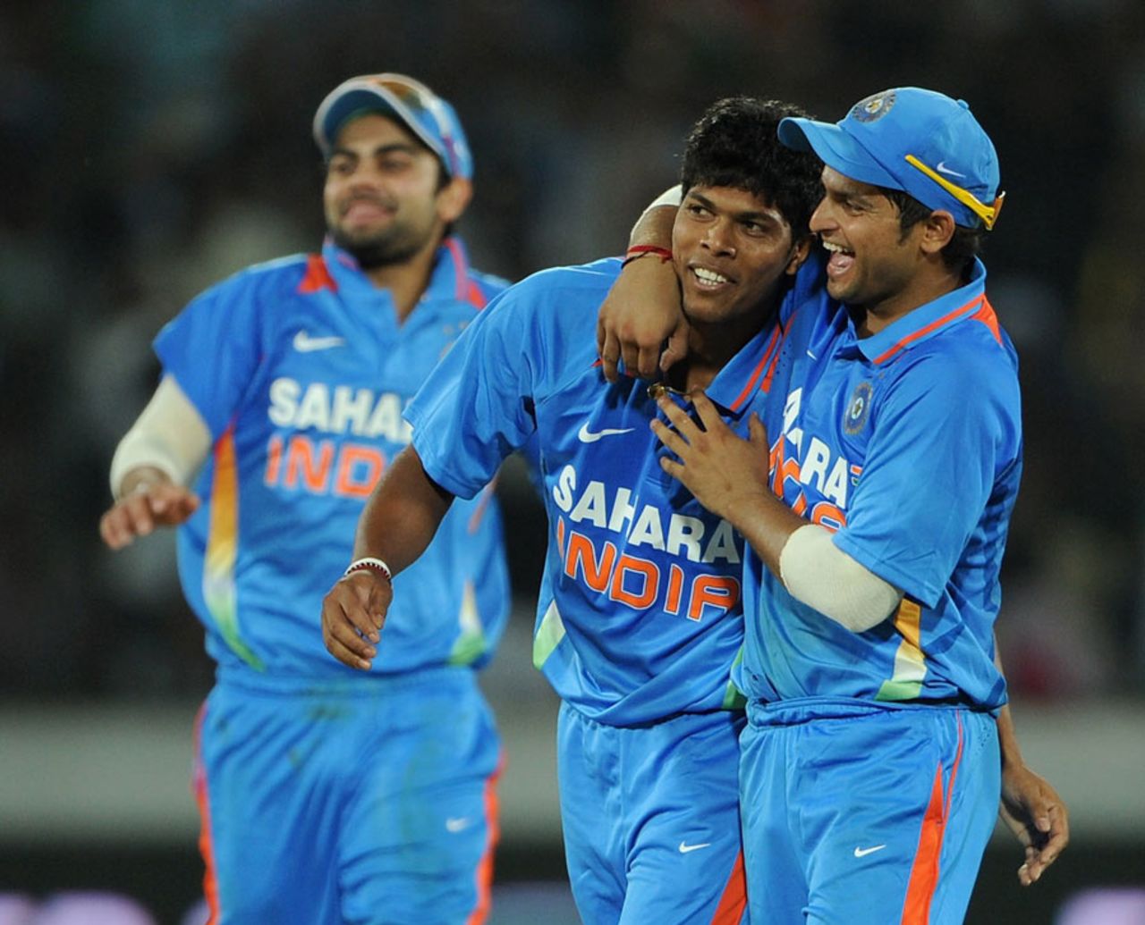 Umesh Yadav is congratulated after one of his two wickets, India v England, 1st ODI, Hyderabad, October 14, 2011
