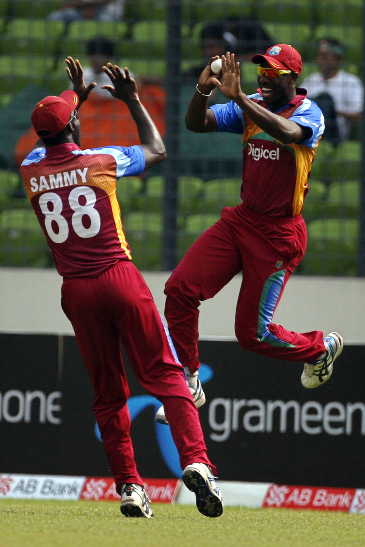Darren Sammy and Andre Russell celebrate a wicket, Bangladesh v West Indies, 2nd ODI, Mirpur, October 15, 2011

