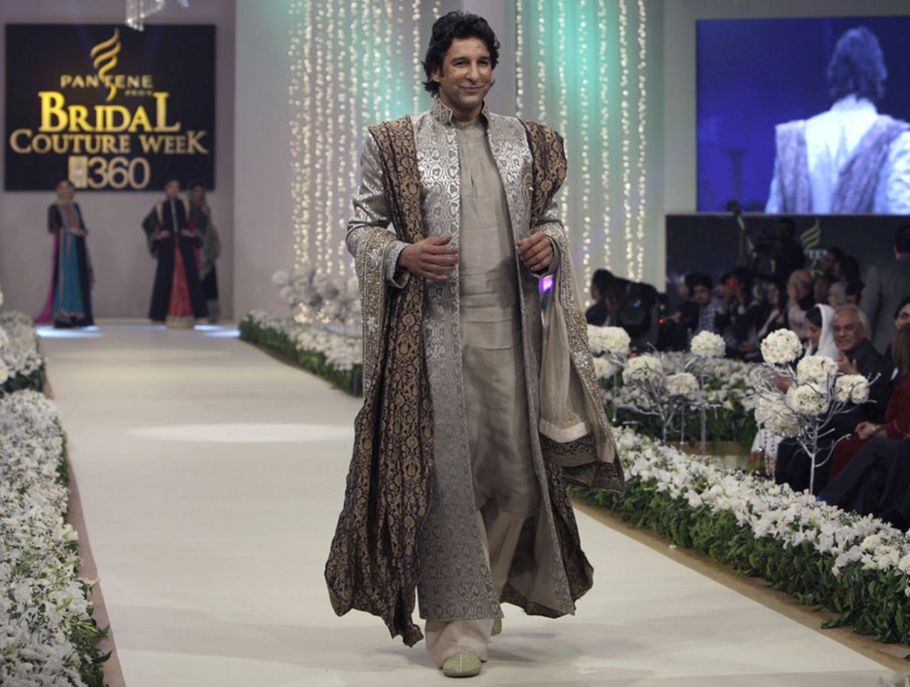 Wasim Akram walks the ramp at a fashion show, Lahore, October 15, 2011
