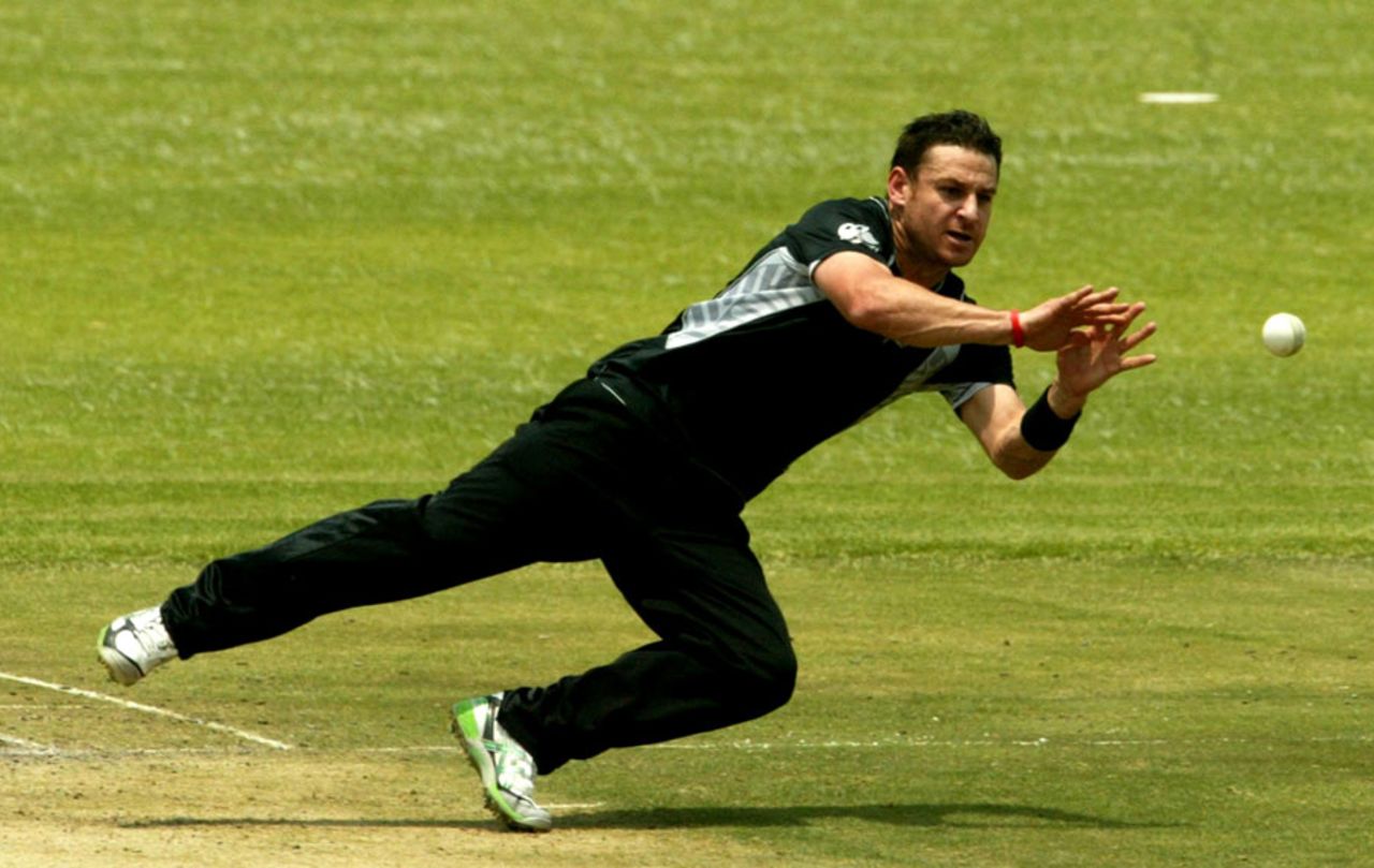 Nathan McCullum dives to his left, Zimbabwe v New Zealand, 1st ODI, Mohali, October 20, 2011 