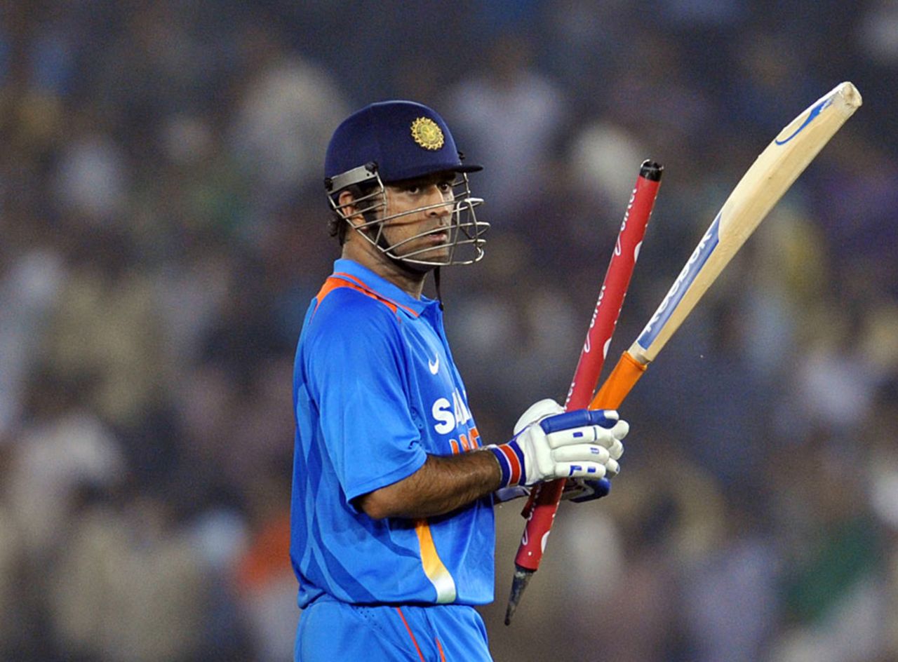 MS Dhoni marches off after a job well done, India v England, 3rd ODI, Mohali, October 20, 2011