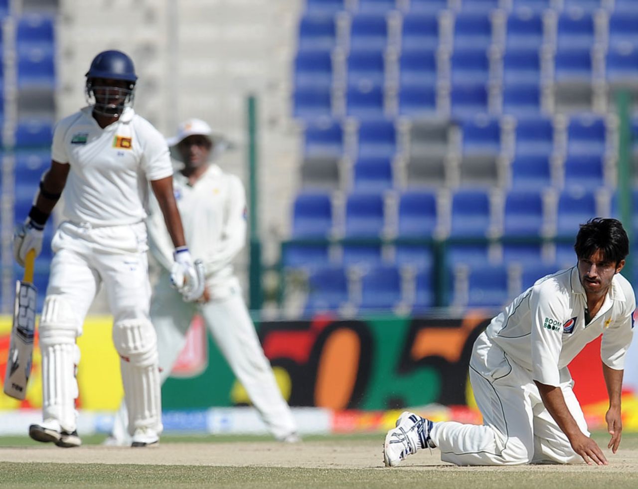 Aizaz Cheema dives to stop a shot from Kumar Sangakkara, Pakistan v Sri Lanka, 1st Test, Abu Dhabi, 5th day, October 22, 2011