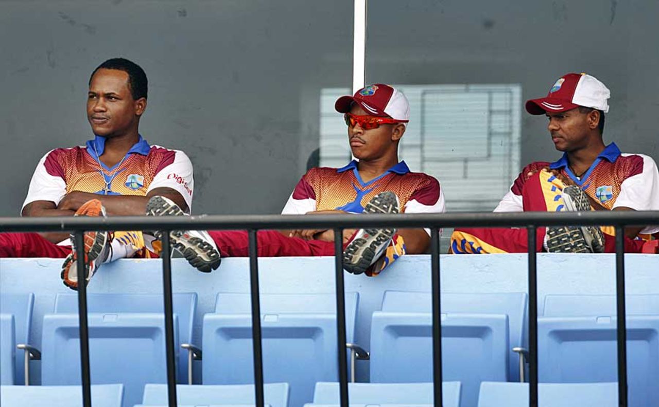 Marlon Samuels, Carlton Baugh and Shivnarine Chanderpaul watch on from the dressing room, Bangladesh v West Indies, 1st Test, Chittagong, 2nd day, October 22, 2011