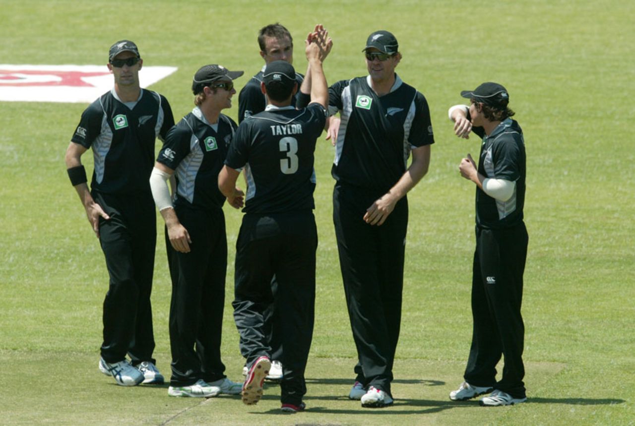 The New Zealand fielders celebrate the fall of Vusi Sibanda, Zimbabwe v New Zealand, 2nd ODI, Harare, October 22, 2011 