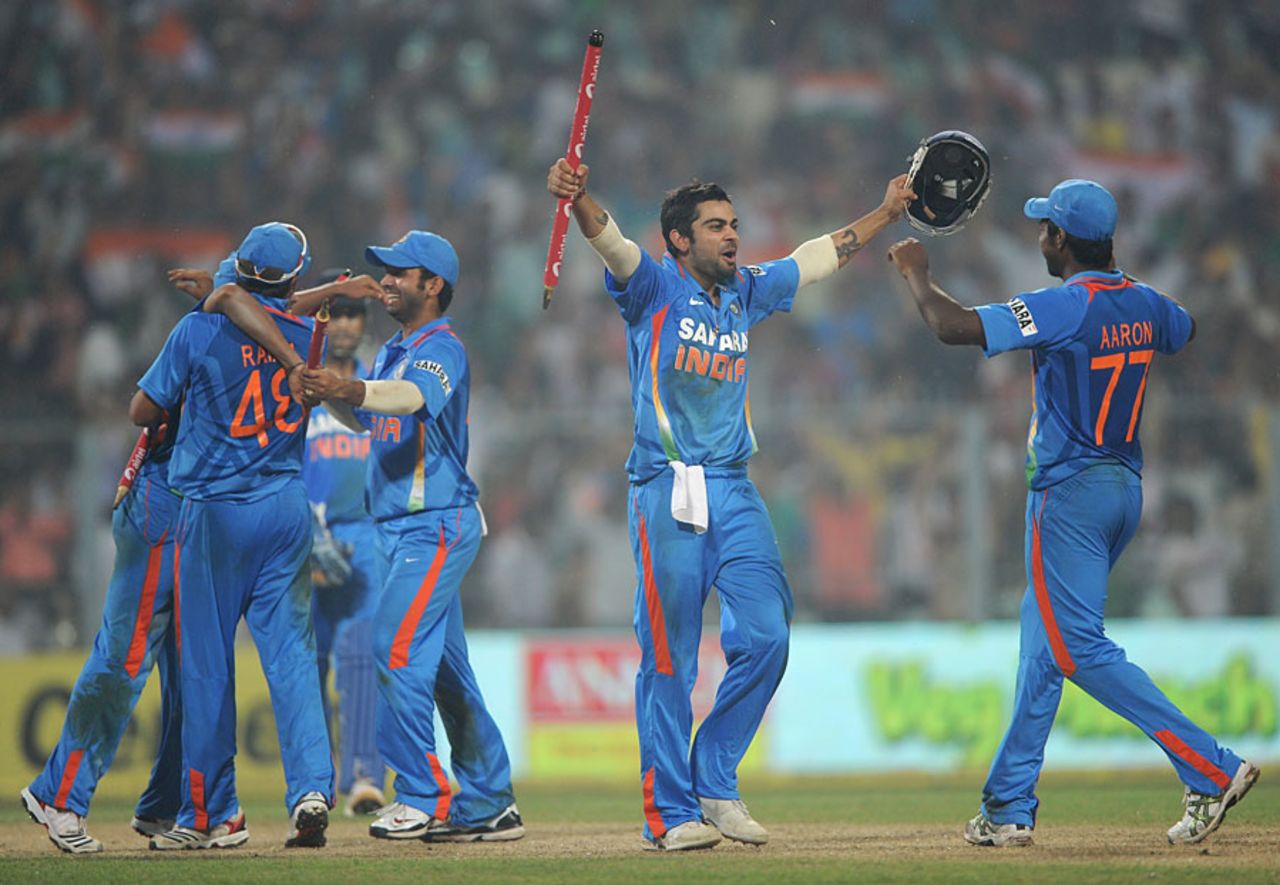 Virat Kohli grabs a stump after India complete the whitewash, India v England, 5th ODI, Eden Gardens, October 25 2011