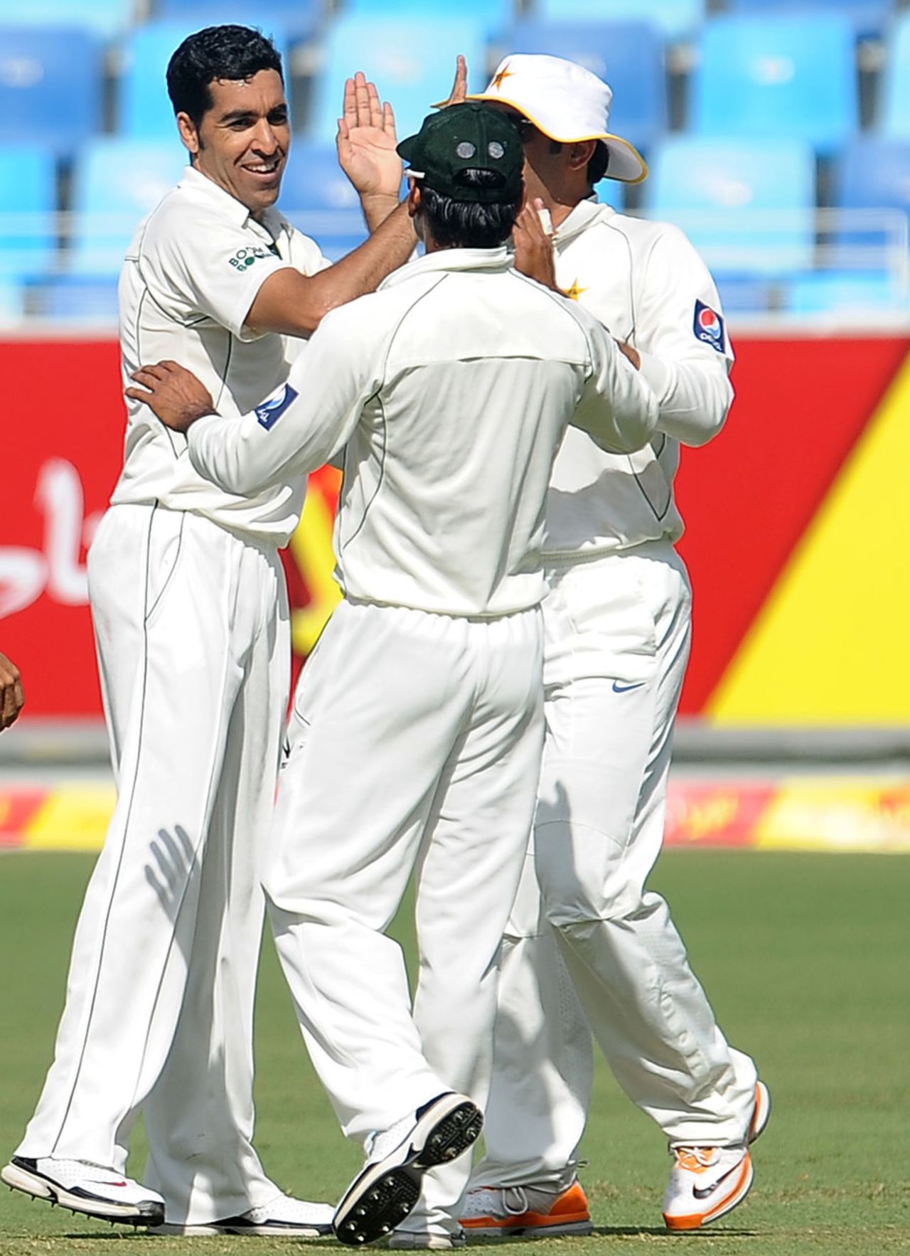 Umar Gul is congratulated on dismissing Lahiru Thirimanne, Pakistan v Sri Lanka, 2nd Test, Dubai, 1st day, October 26, 2011 