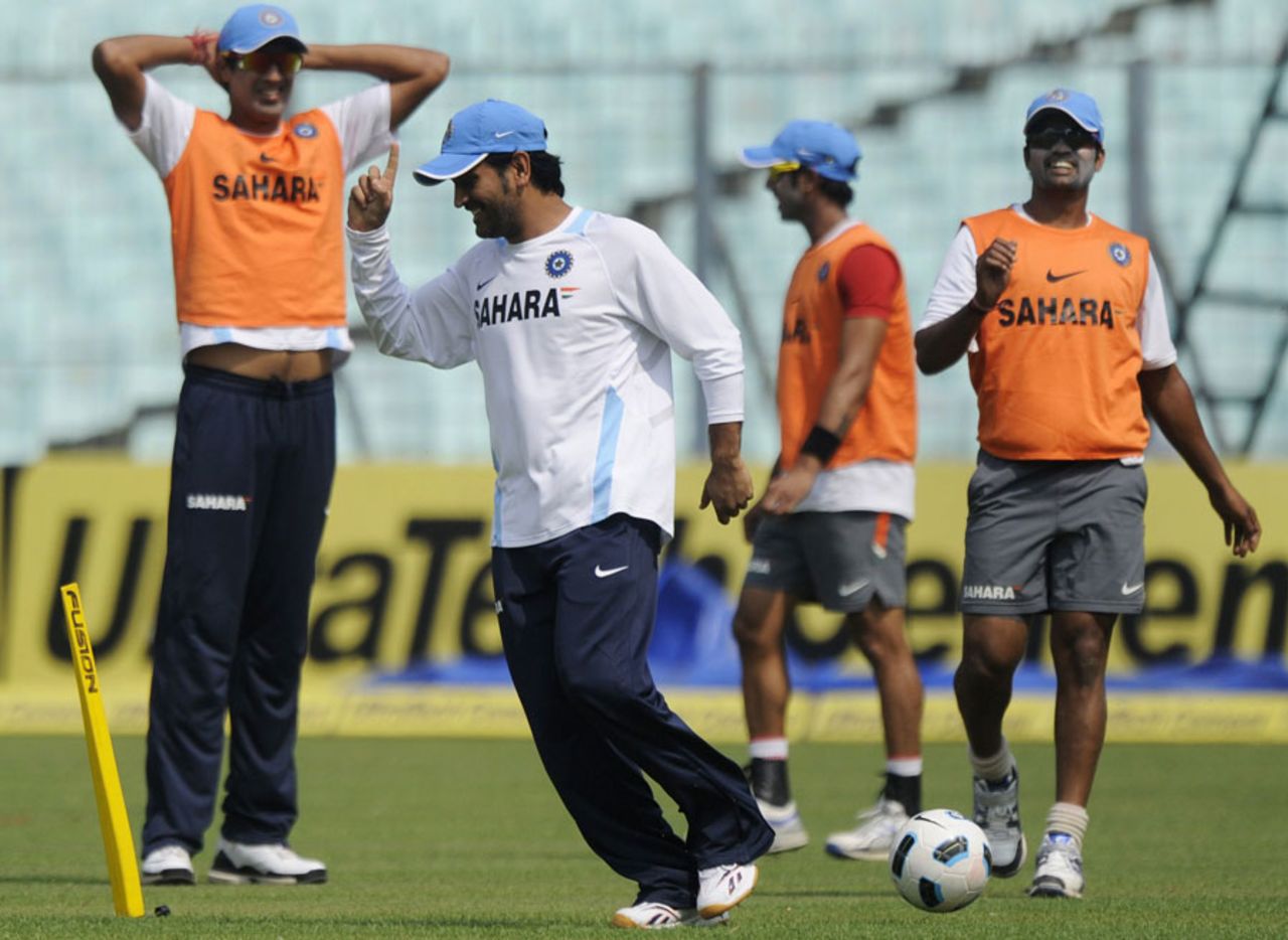 India captain MS Dhoni celebrates after scoring a goal during practice, Kolkata, October 28, 2011