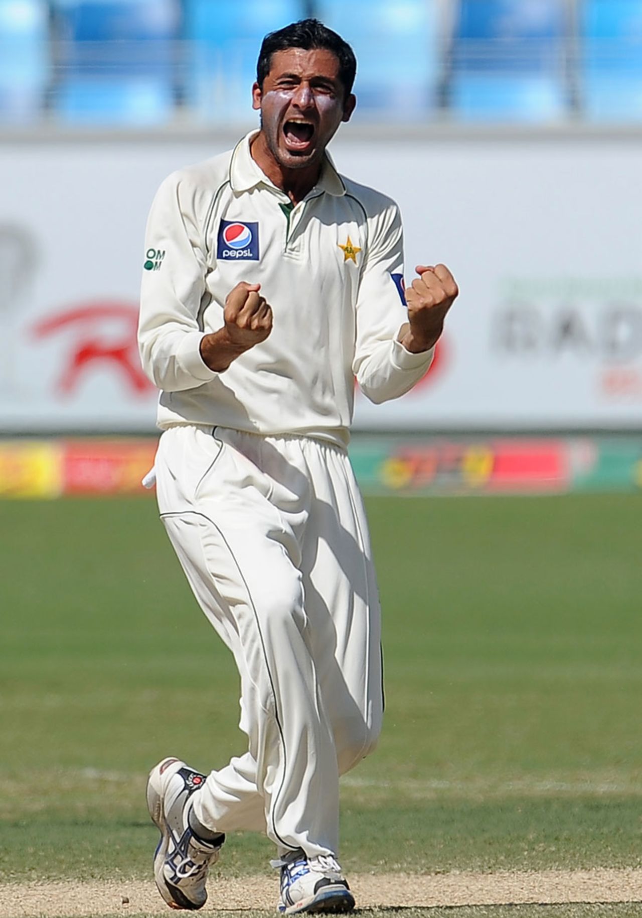 Junaid Khan is pumped up after taking a wicket, Pakistan v Sri Lanka, 2nd Test, Dubai, 4th day, October 29, 2011