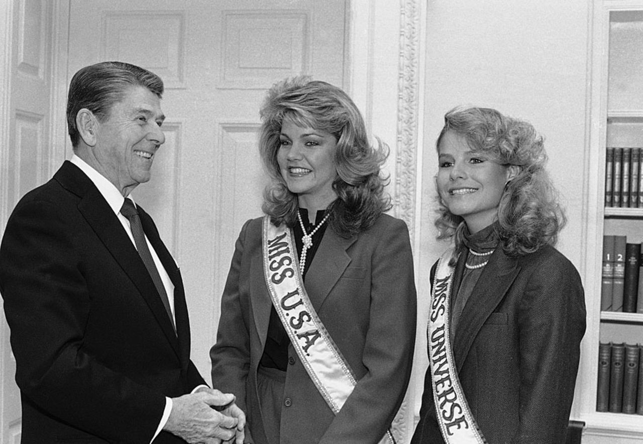 Lorraine Downes, Miss Universe, and Julie Hayek, Miss USA, meet President Reagan at the White House, Washington, January 9, 1984