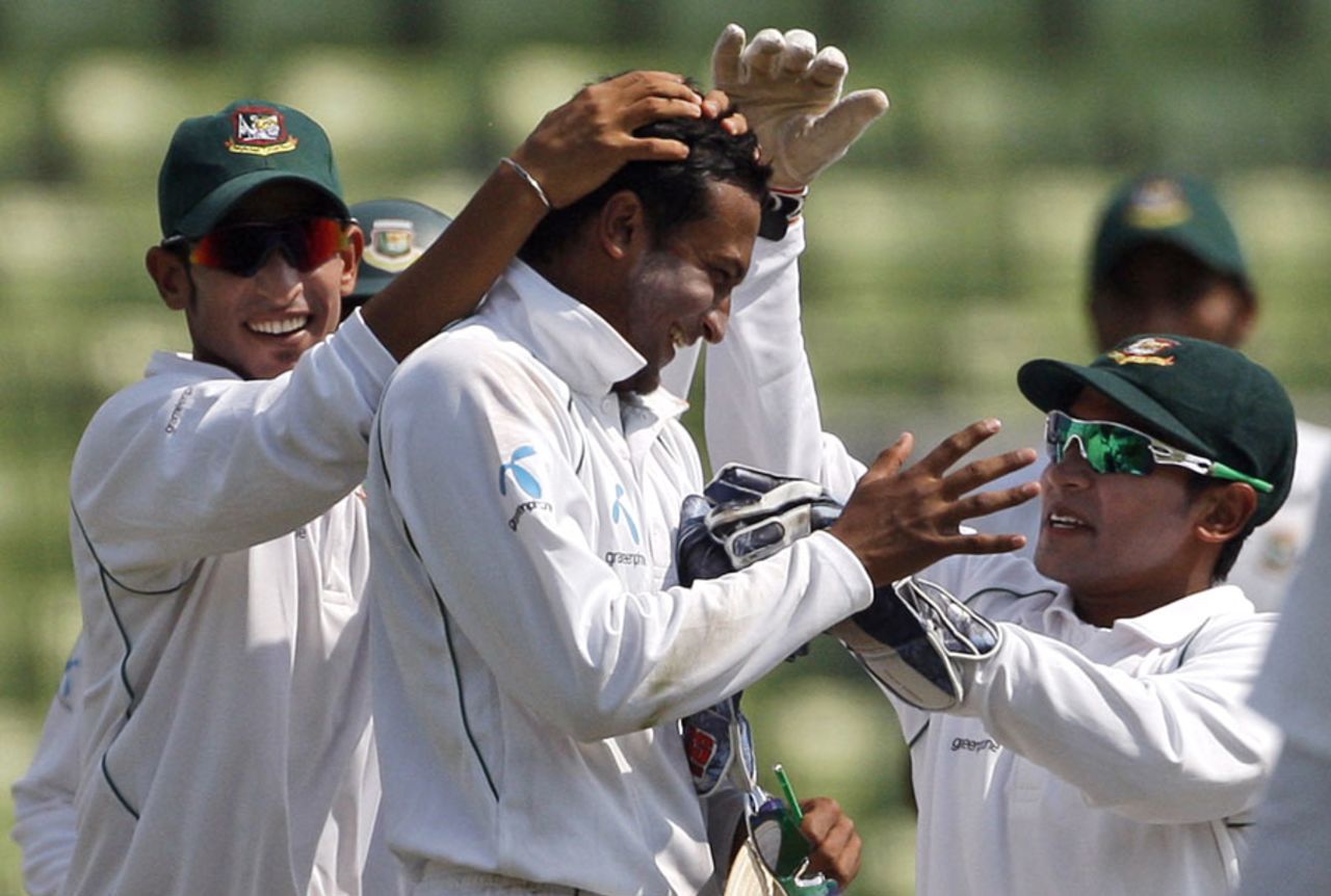 Shakib Al Hasan is congratulated by his team-mates after taking five wickets in West Indies first innings, Bangladesh v West Indies, 2nd Test, Mirpur, 2nd day, October 30, 2011
