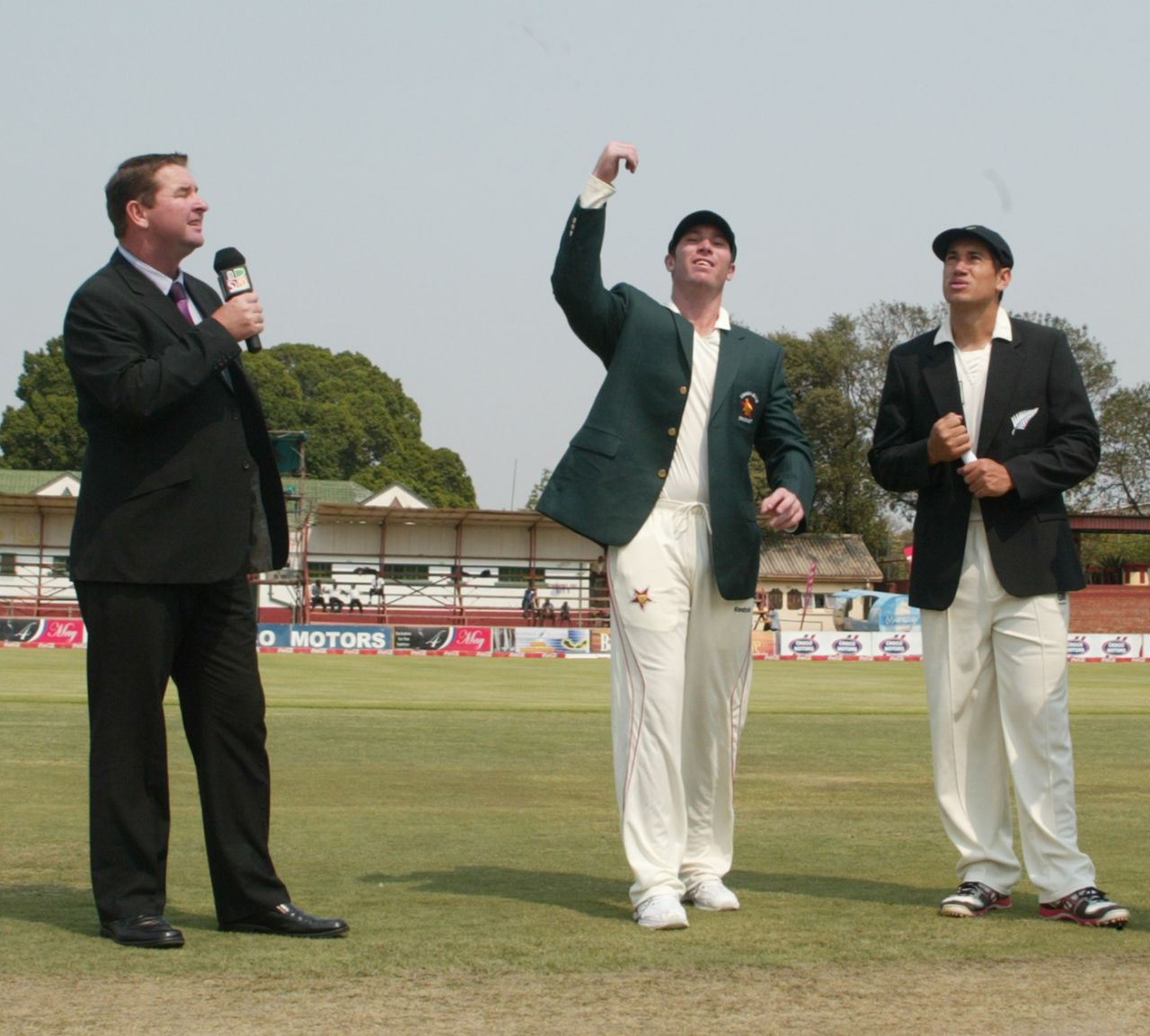 Brendan Taylor spins the coin at the toss as Ross Taylor and Alistair Campbell look on, Zimbabwe v New Zealand, only Test, Bulawayo, 1st day, November 1, 2011