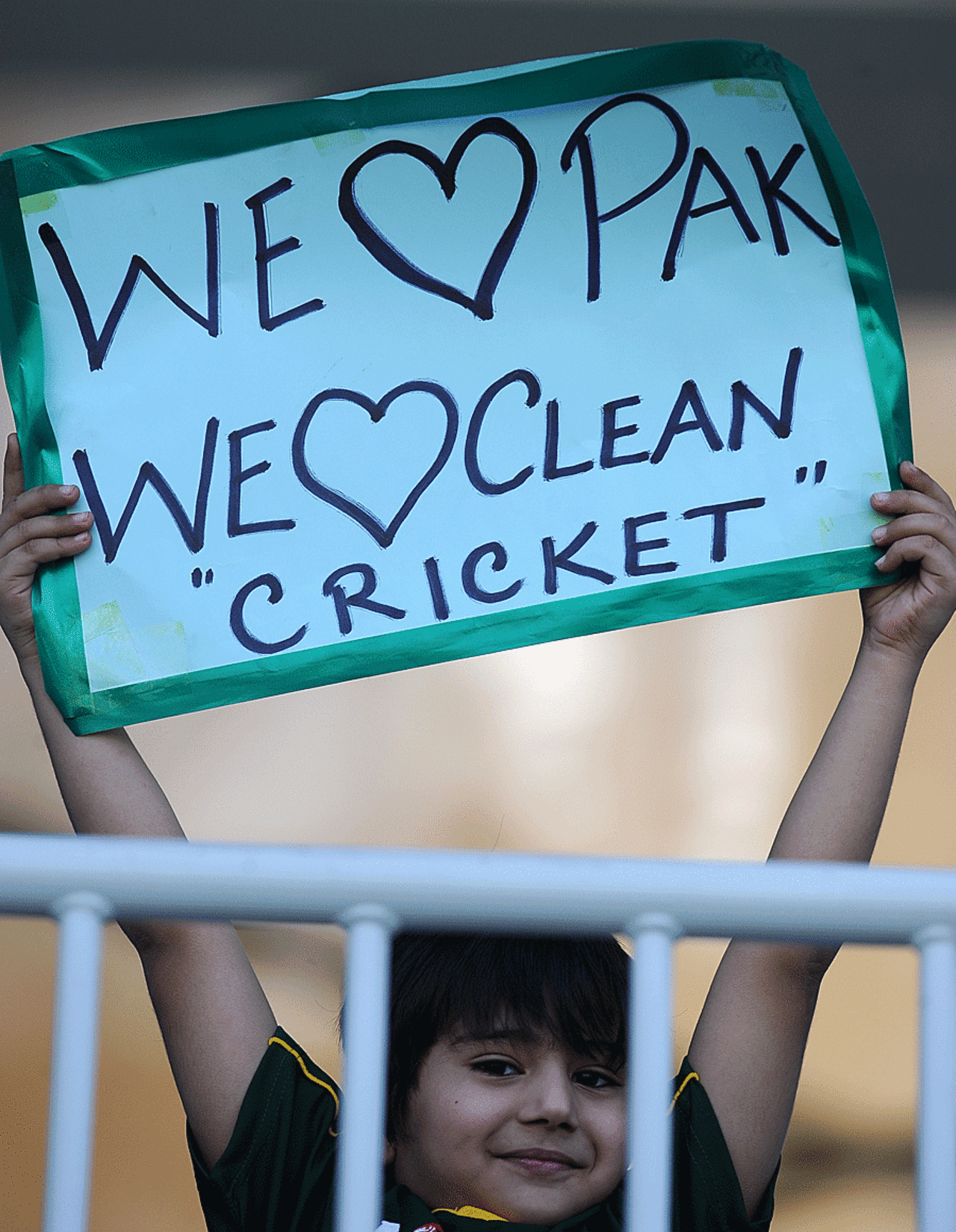 A young fan keeps the cheer despite the spot-fixing punishments in London, Pakistan v Sri Lanka, 3rd Test, Sharjah, 2nd day, November 4, 2011