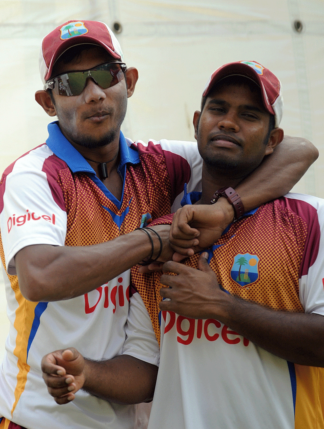 Davendra Bishoo has his arm around Adrian Barath, New Delhi, November 5, 2011