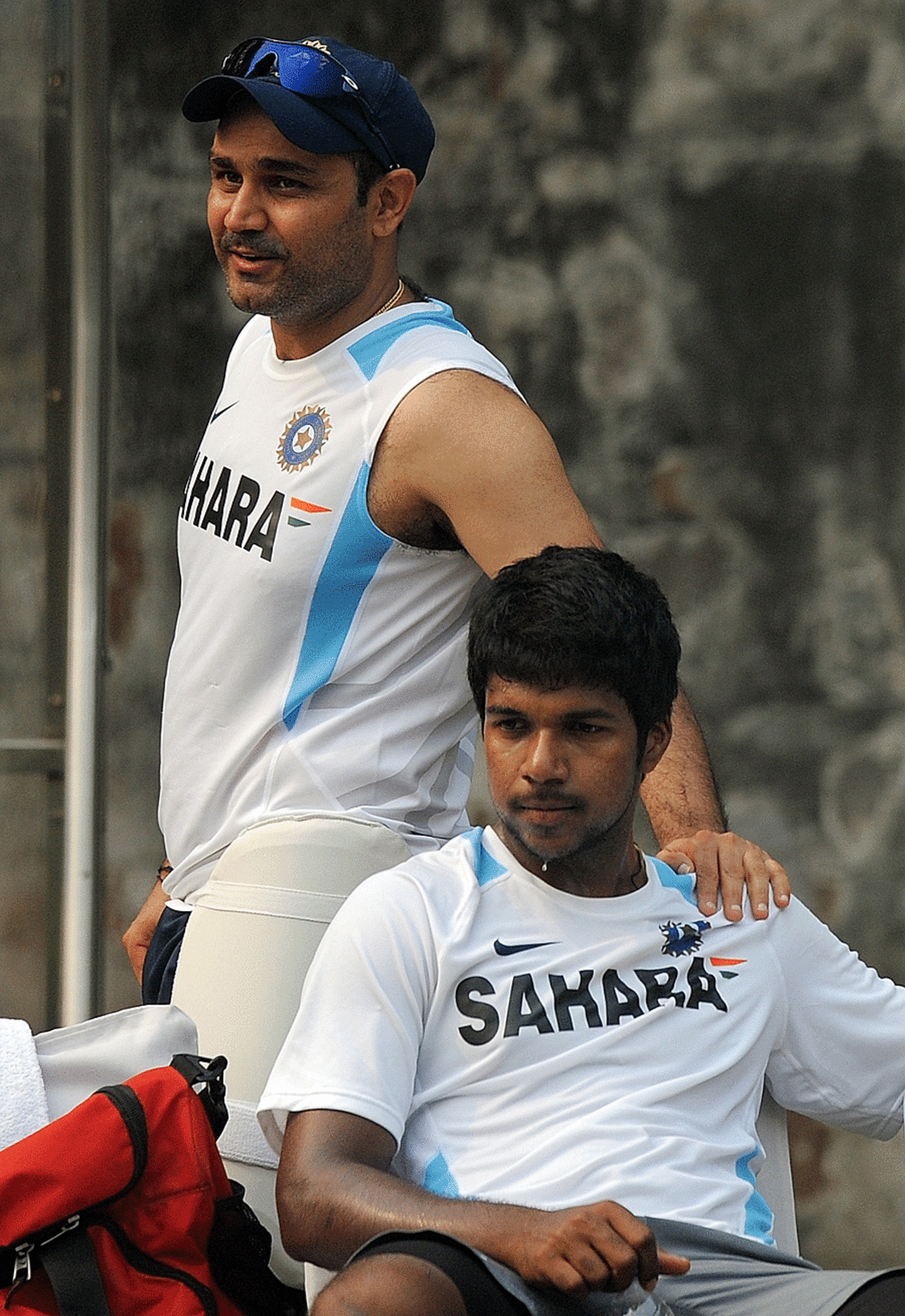 Virender Sehwag and Varun Aaron take a break, New Delhi, November 5, 2011