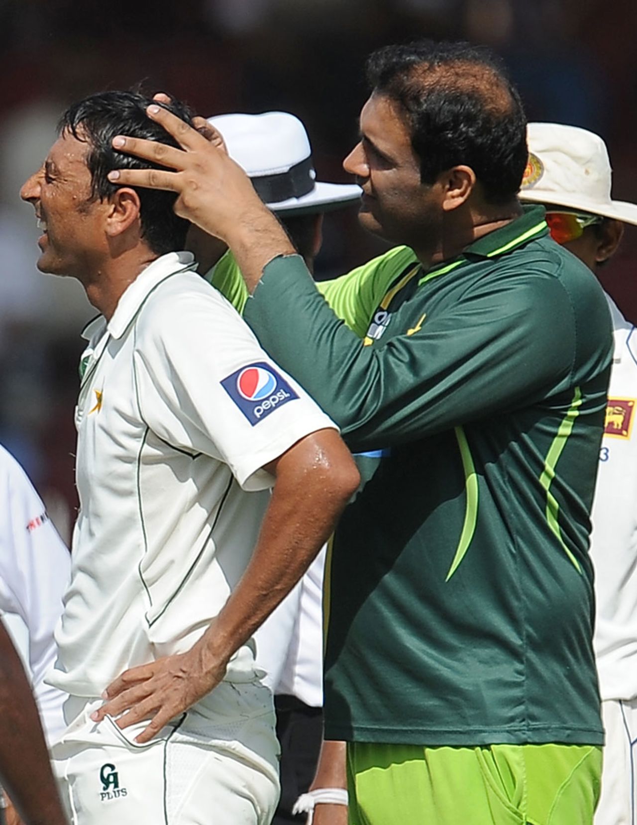 Younis Khan receives some treatment after being hit on the helmet, Pakistan v Sri Lanka, 3rd Test, Sharjah, 3rd day, November 5, 2011