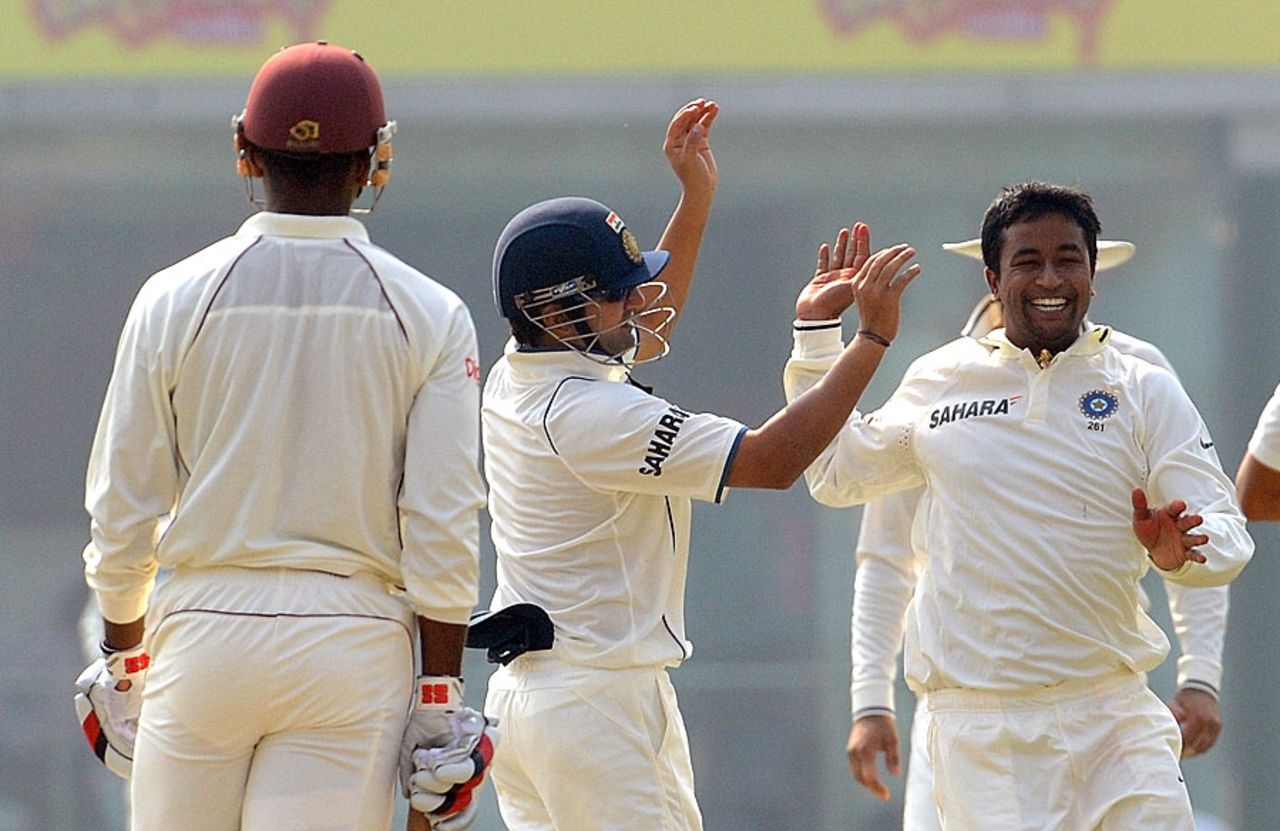 Pragyan Ojha and the rest celebrate a breakthrough, India v West Indies, 1st Test, New Delhi, 1st day, November 6, 2011