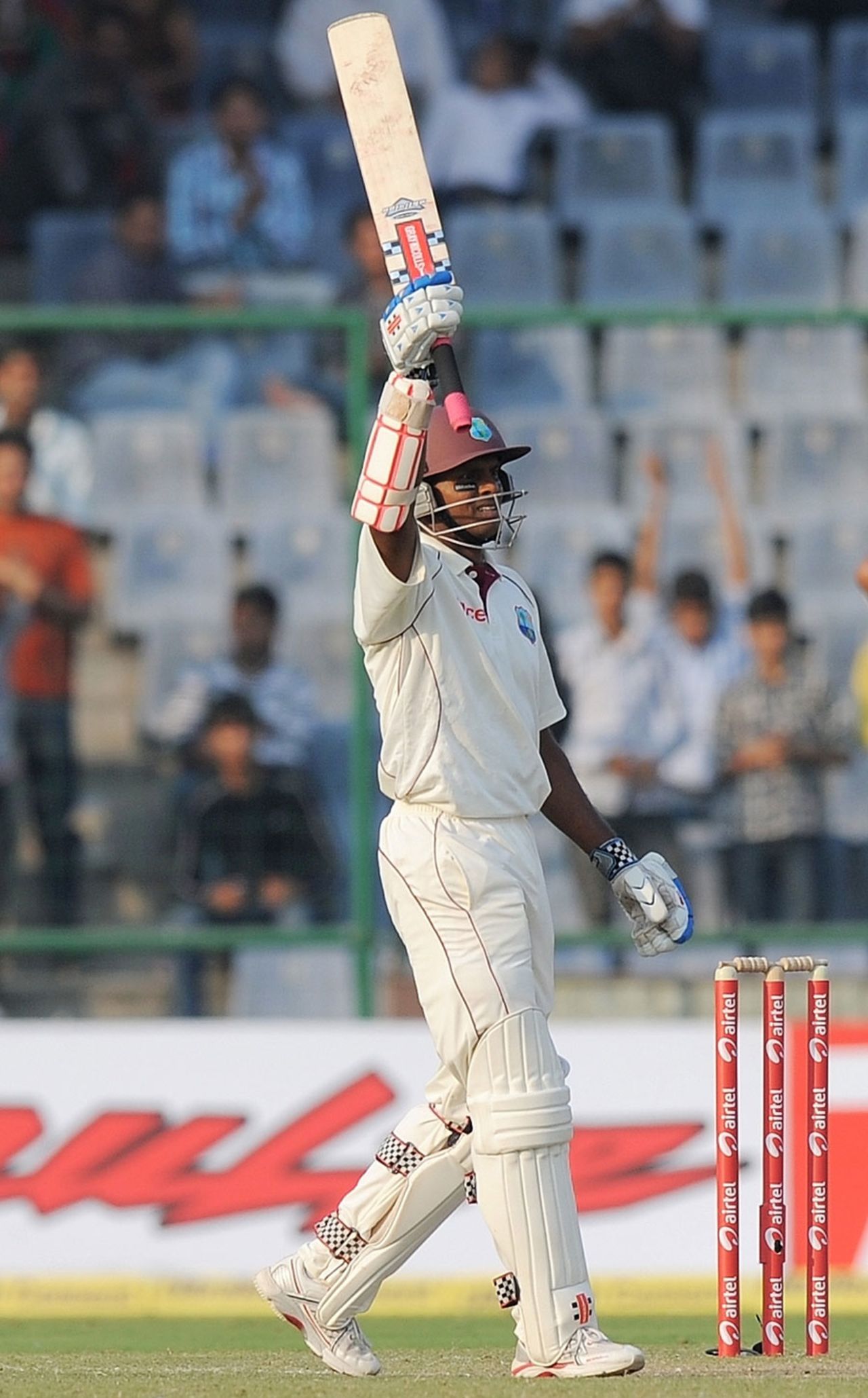 Shivnarine Chanderpaul raises his bat after reaching his century, India v West Indies, 1st Test, New Delhi, 1st day