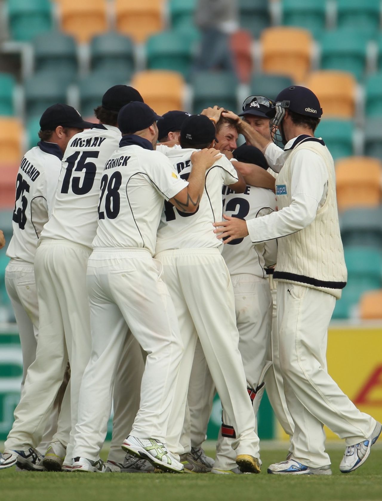 James Pattinson embraced by team-mates after taking the final wicket, Tasmania v Victoria, Sheffield Shield, day 4, Hobart, Nov 7 2011