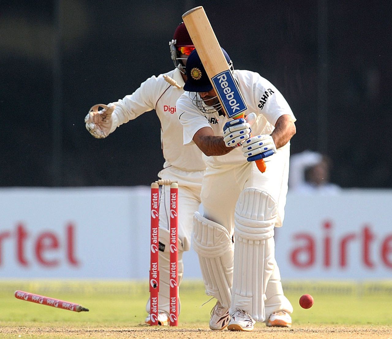 MS Dhoni loses his off stump to Darren Sammy, India v West Indies, 1st Test, New Delhi, 2nd day, November 7, 2011