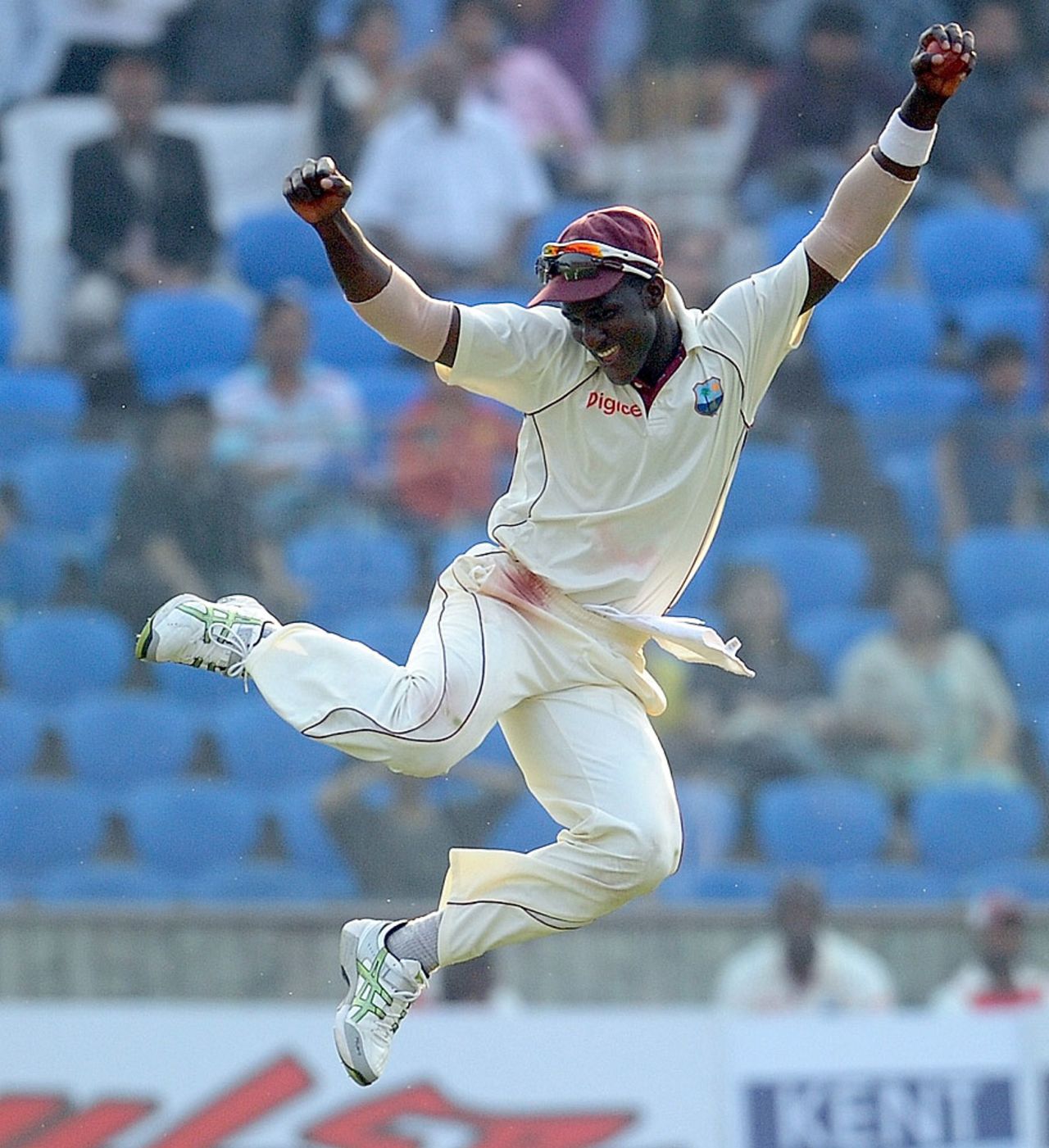 Footloose: Darren Sammy lets it rip after the fall of Rahul Dravid, India v West Indies, 1st Test, New Delhi, 2nd day, November 7, 2011