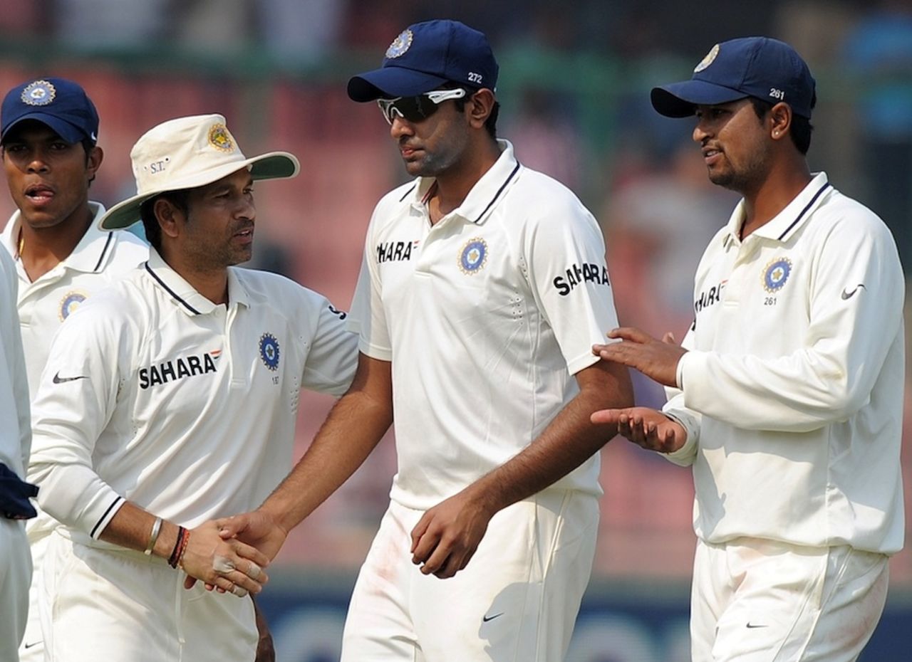 Sachin Tendulkar congratulates R Ashwin on his 6 for 47, India v West Indies, 1st Test, New Delhi, 3rd day, November 8, 2011