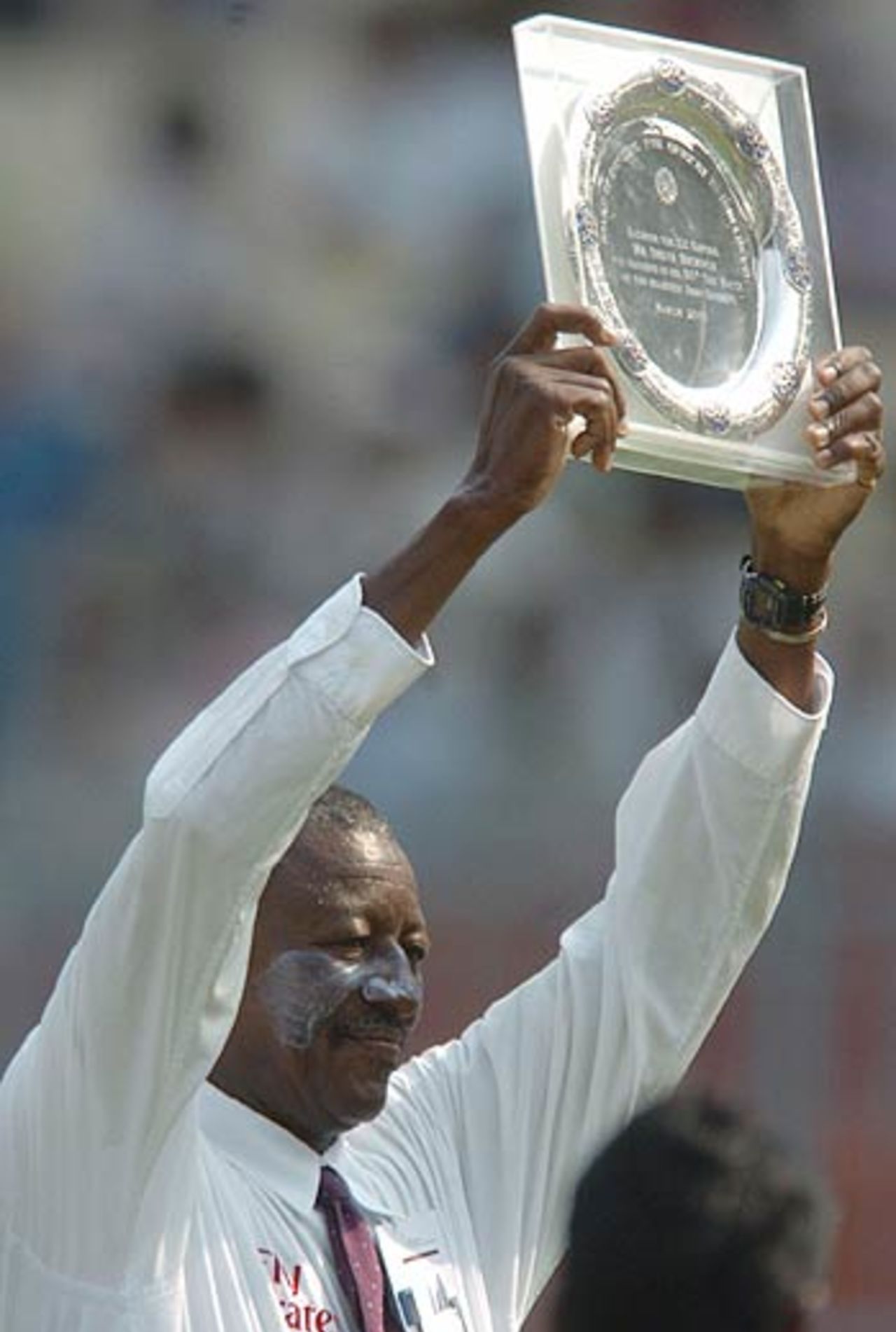 Steve Bucknor, who became the first man to officiate in 100 Tests, was presented with a plaque by the BCCI before the start of the day's play, India v Pakistan, 2nd Test, Kolkata, March 16, 2005