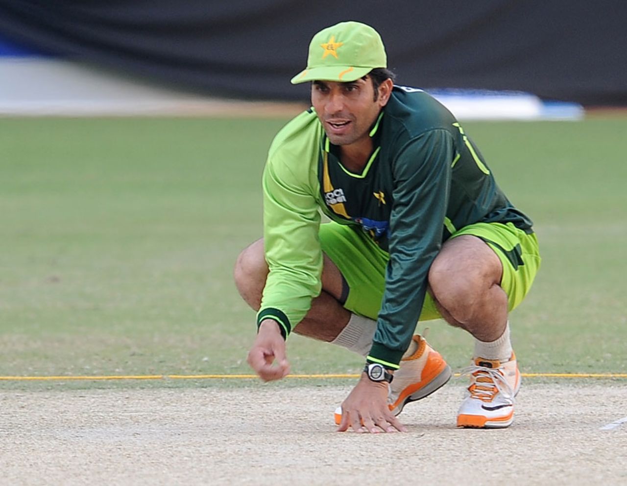 Misbah-ul-Haq has a look at the pitch, Dubai, November 13, 2011